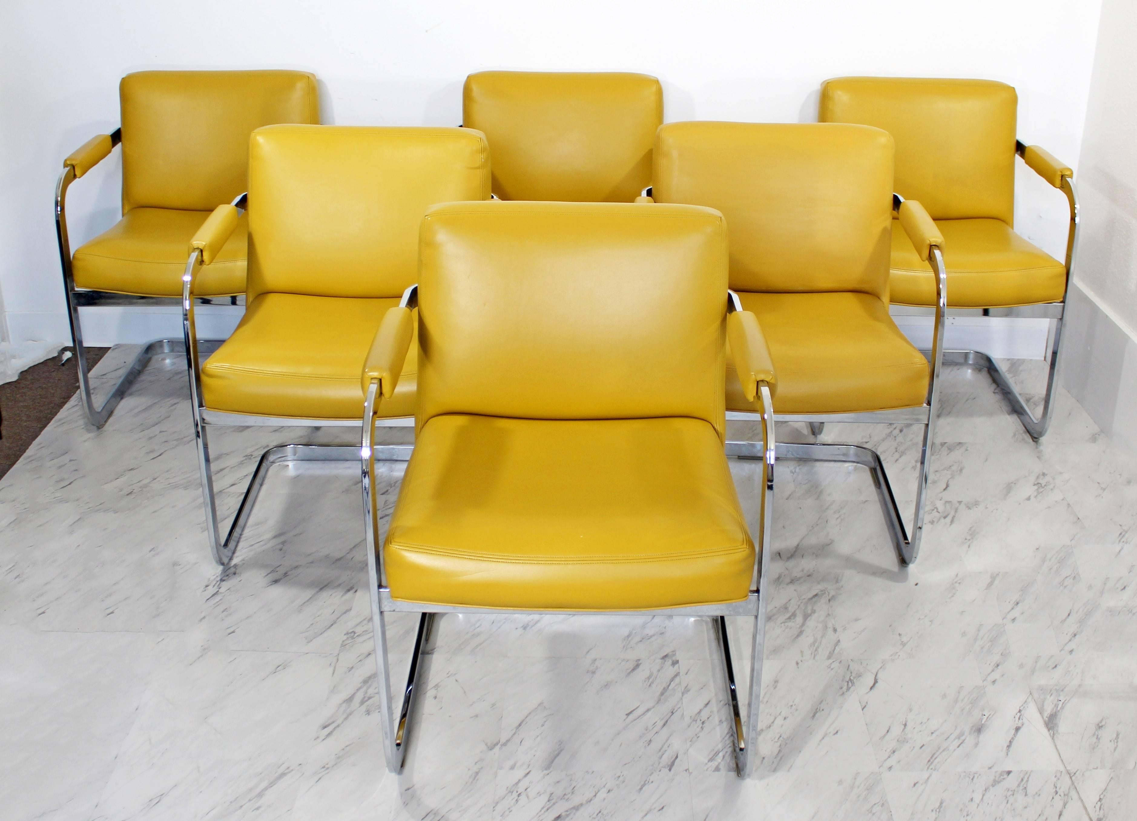 For your consideration is a fun and sexy, set of six, cantilever chrome dining chairs, designed by Milo Baughman for Thayer Coggin In very good condition, with original tags. Mustard yellow leather upholstery. The dimensions are 23