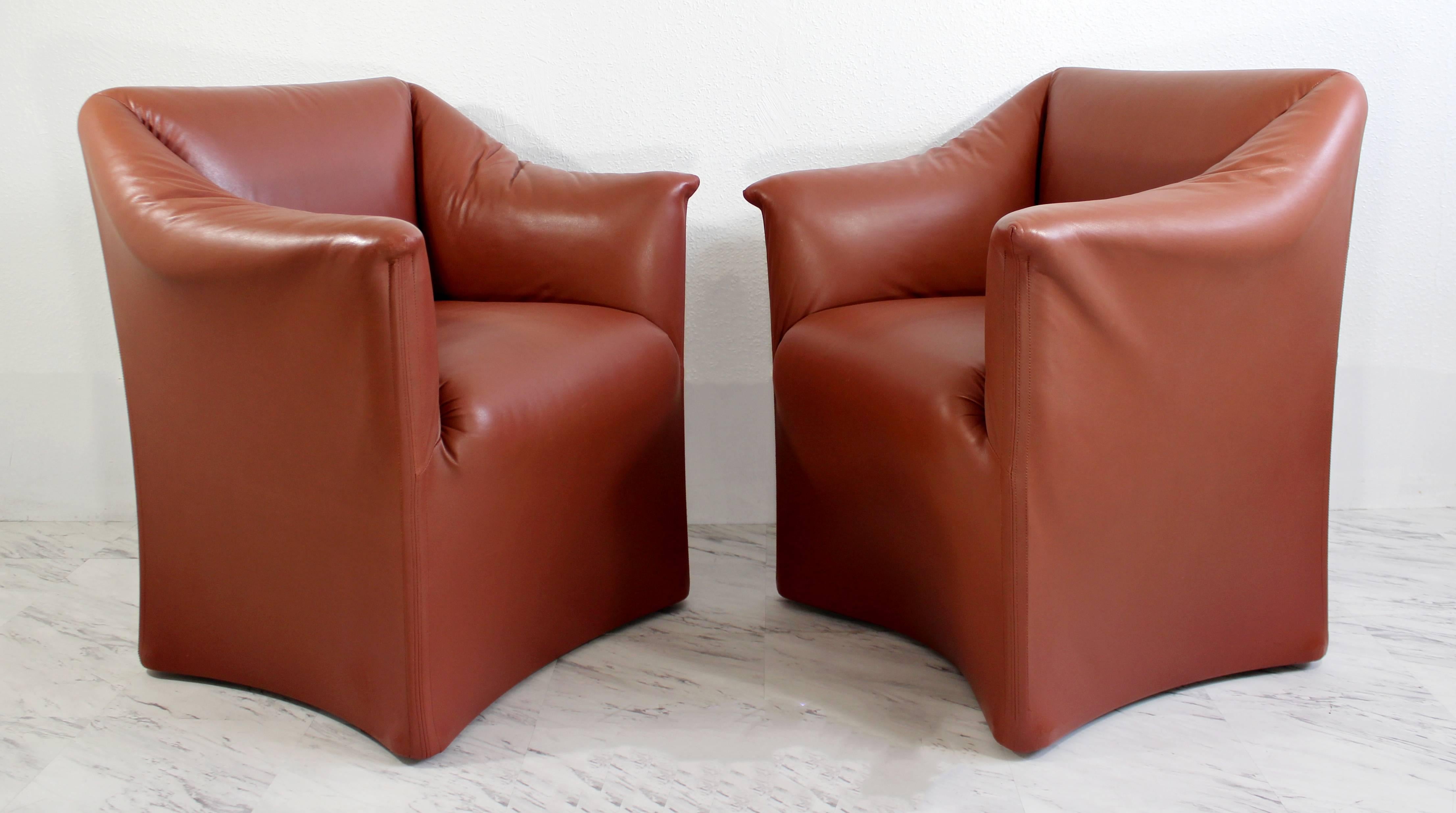 For your consideration is a daring pair of tentazione leather club chairs by Mario Bellini for Cassina. In great condition. The dimensions are 31