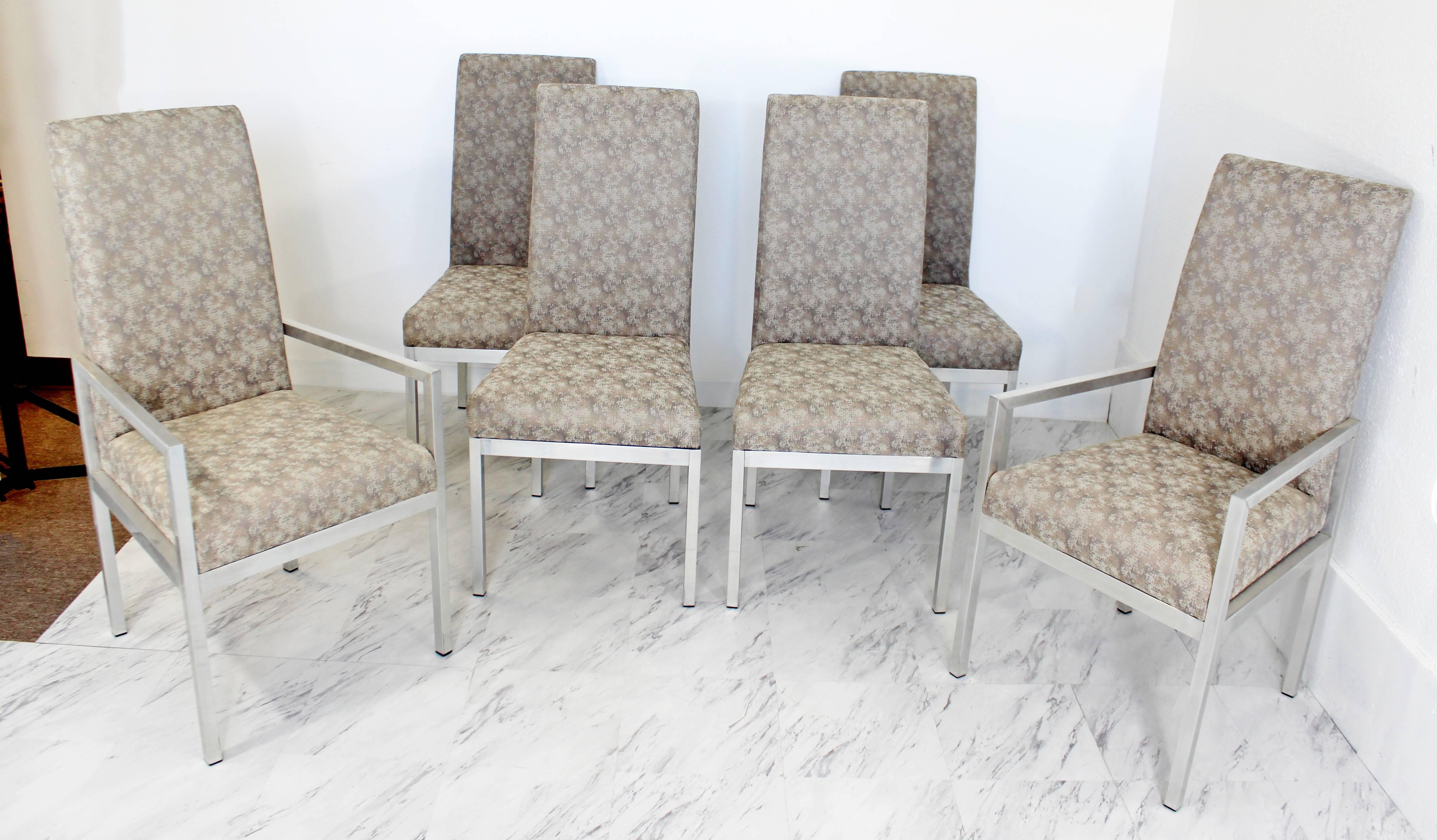 For your consideration is a stunning set of six aluminum base dining chairs. Two armchairs and four side chairs. Attributed to Milo Baughman for DIA. In excellent condition. The dimensions are 20"/21.5" W x 22" D x 41.5" H x