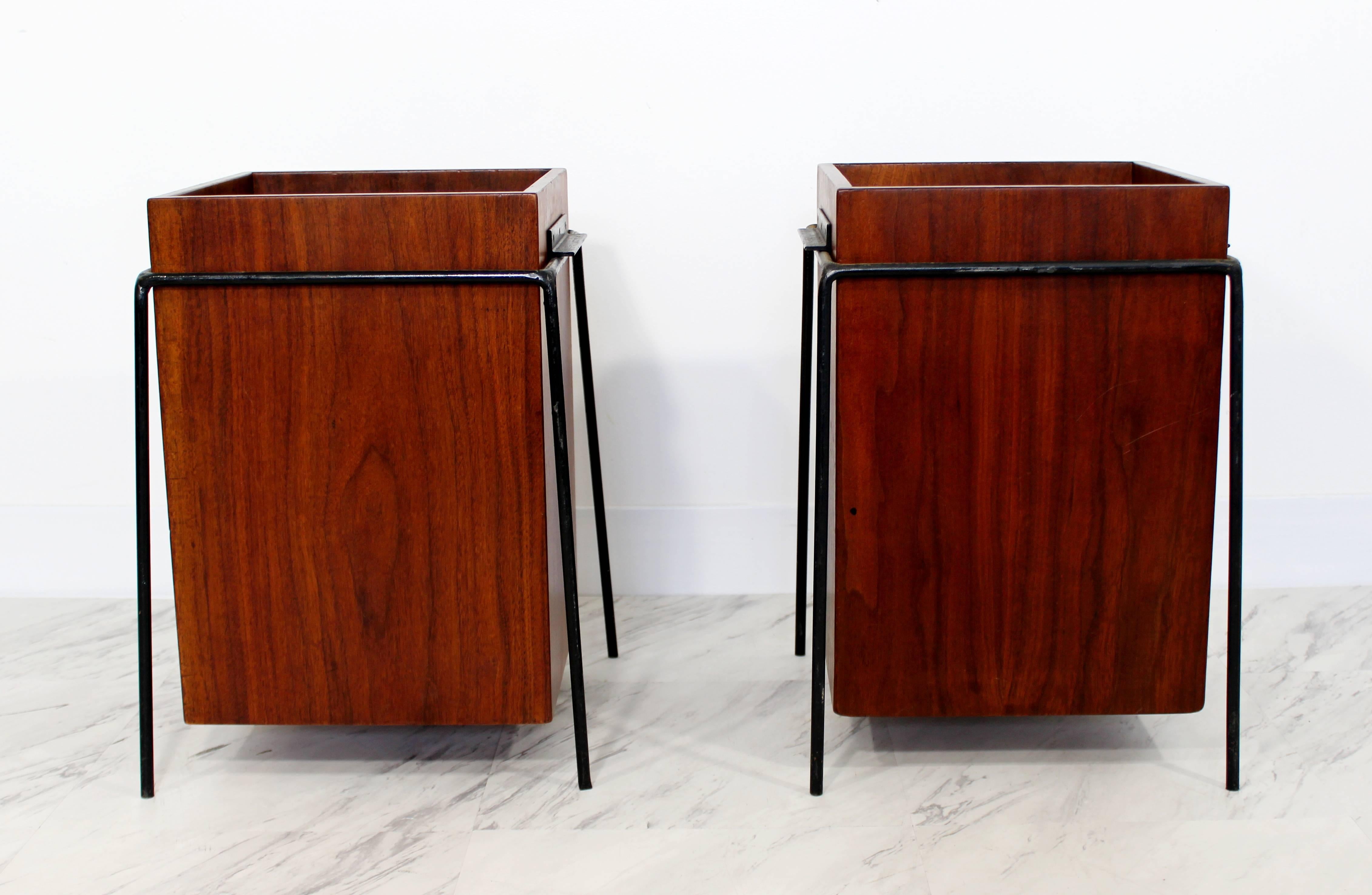 For your consideration is a gorgeous pair of suspended walnut trash cans, on iron frames, by Alvin Lustig. These were custom-made for the executive offices of JL Hudson. This posting is for 1 trash can, 2 are available. In excellent condition. The