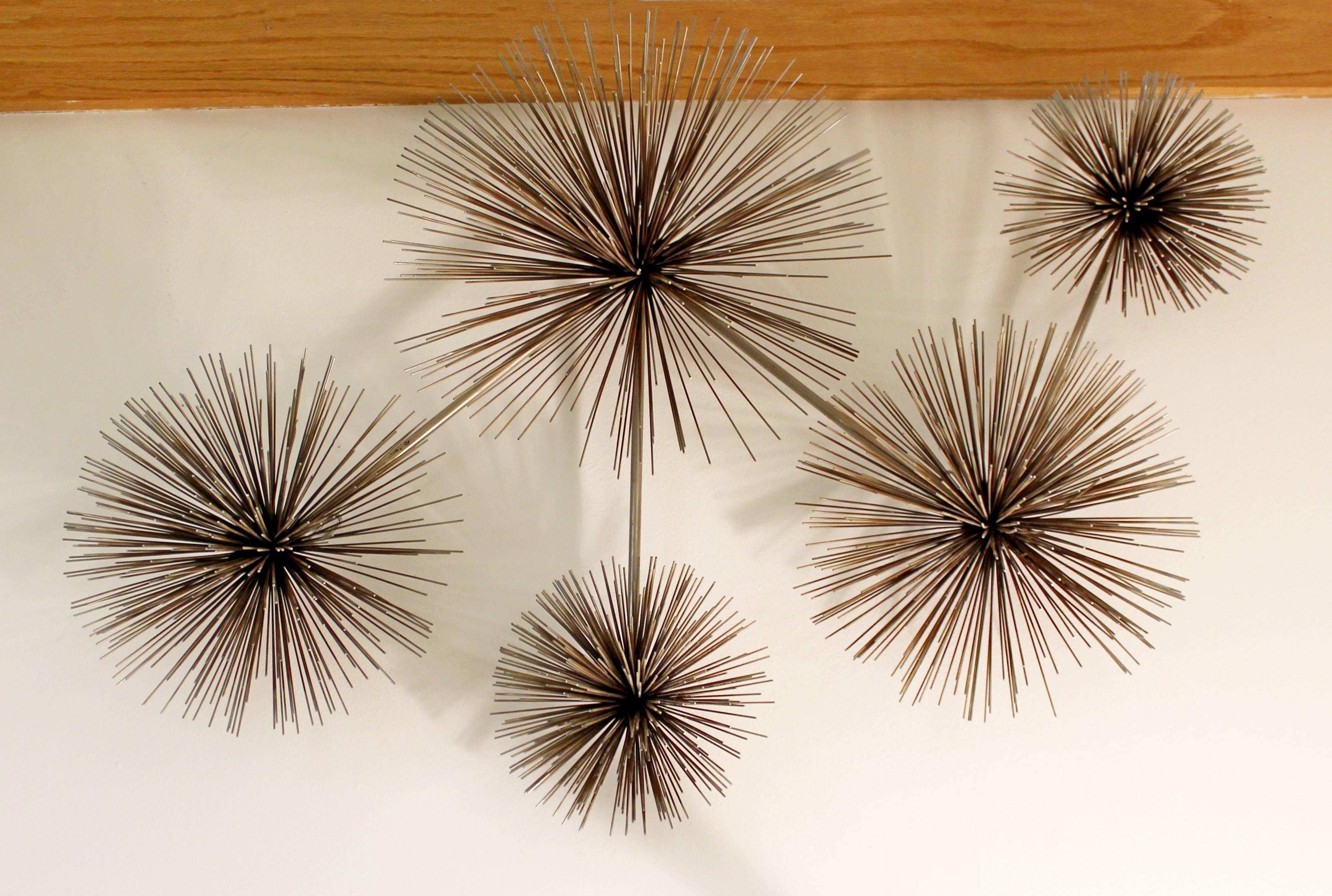 For your consideration is a Classic, brass pom pom hanging wall sculpture, designed and signed by Curtis Jere. In excellent condition. The dimensions are 39