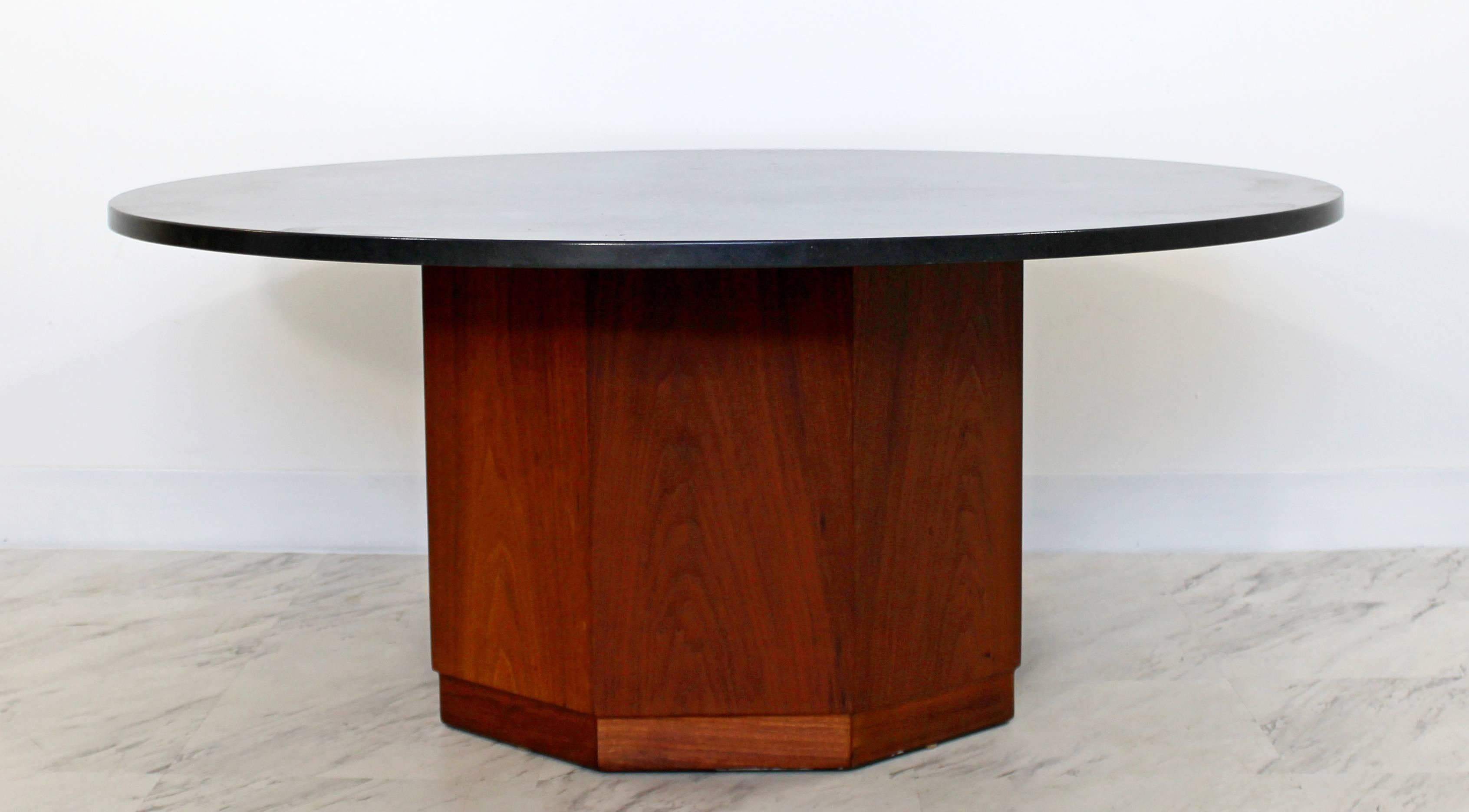 For your consideration is an iconic coffee table by renowned architect Fred Kemp, from the 1960s. The round slate top with octagonal walnut base is in good vintage condition. The dimensions are 42