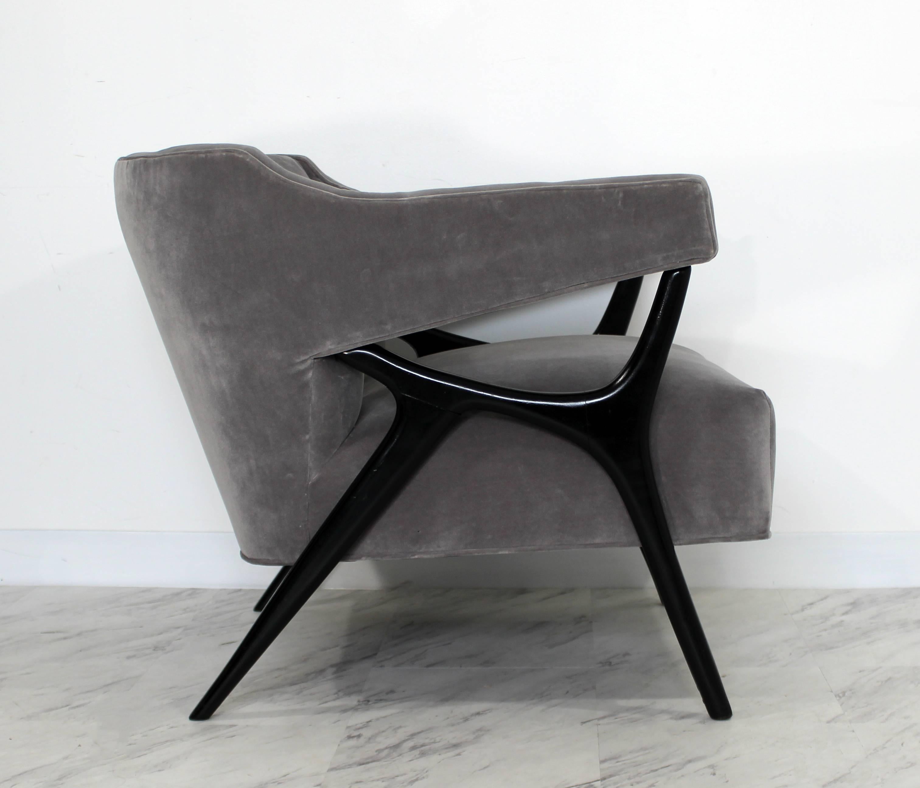 For your consideration is an amazing sculptural Italian lounge chair, black ebonized wood frame. Chair was just professionally reupholstered in grey velvet fabric. In excellent condition. The dimensions are 30
