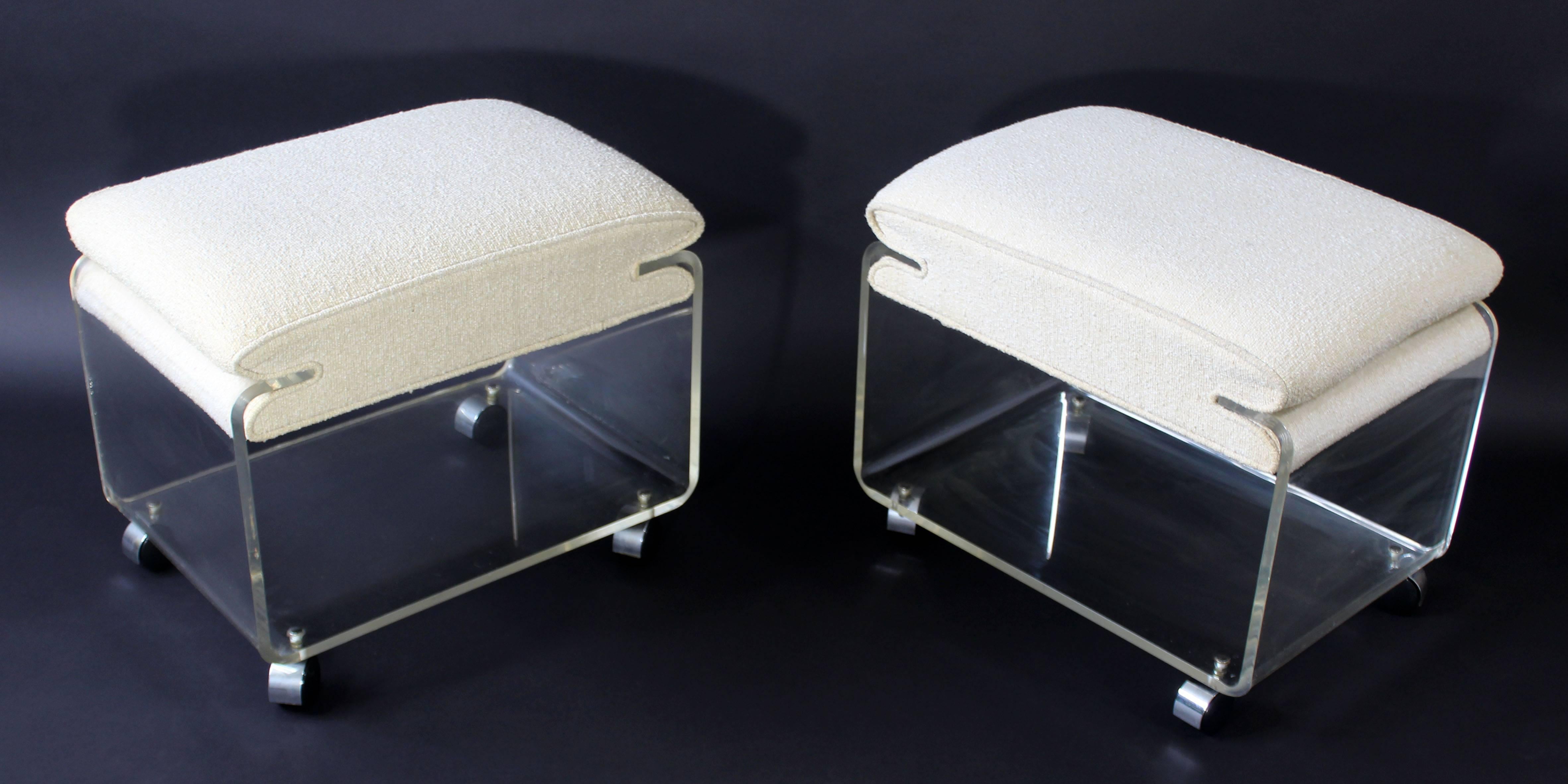 For your consideration is a sleek and chic pair of Lucite, rolling stools, ottomans, by Charles Hollis Jones, circa the 1970s. In excellent condition. The dimensions are 21