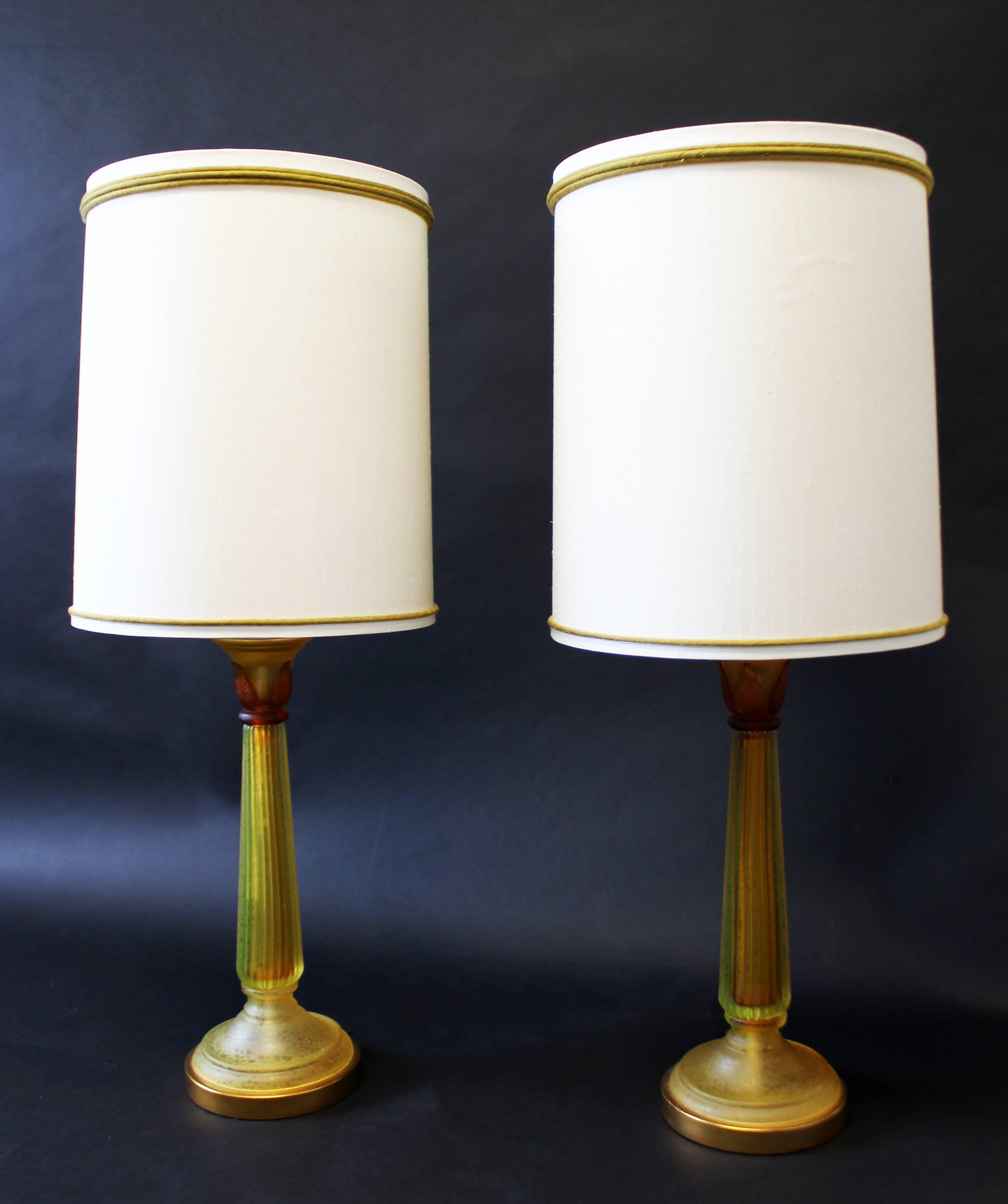 For your consideration is a magnificent pair of amber colored, glass table lamps, with their original shades and finials, by Marbro Lamp Co. In excellent condition. The dimensions of the lamps are 8