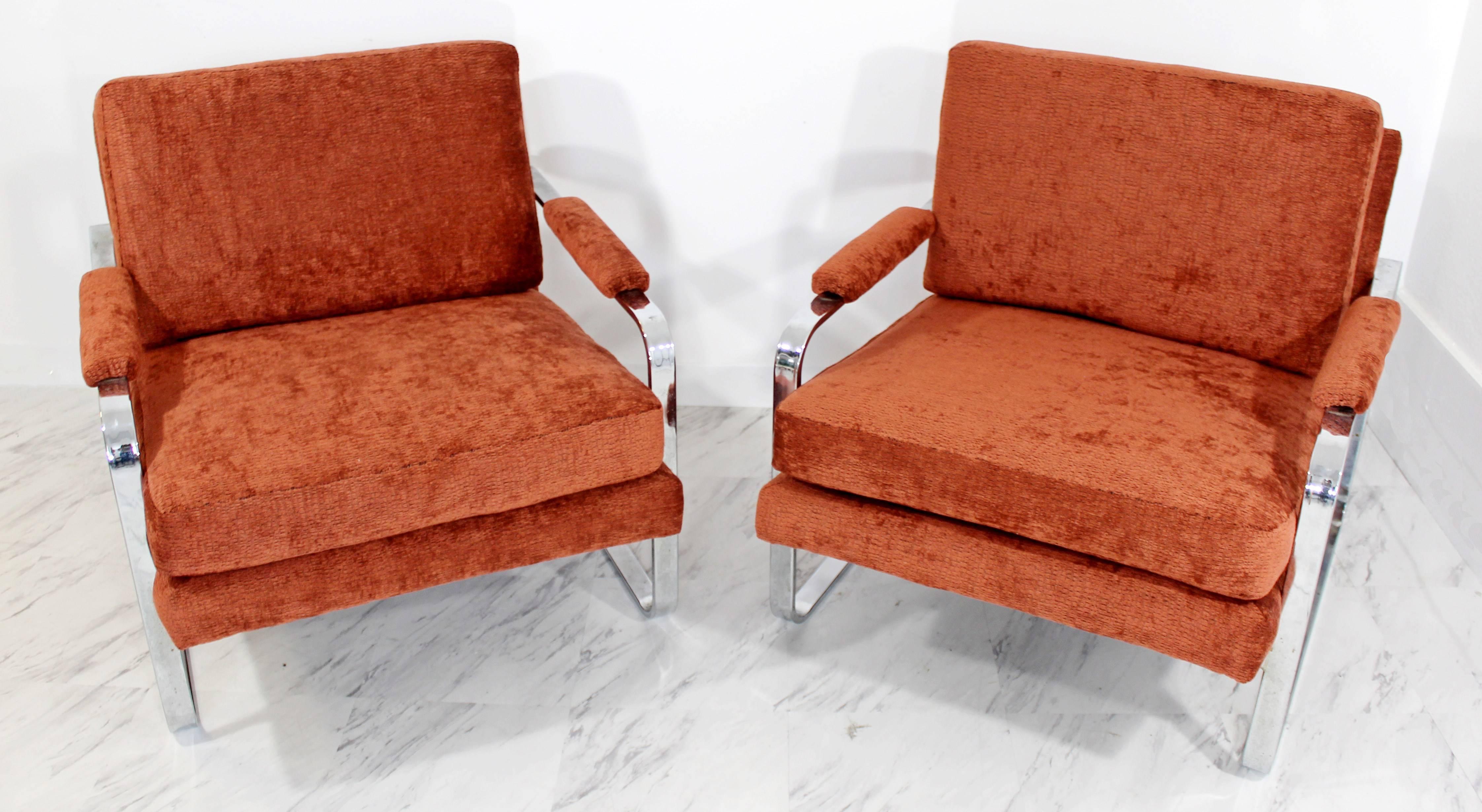For your consideration is a fabulous pair of flat bar chrome lounge chairs with a maroon/ coral chenille upholstery. Professionally reupholstered and in excellent condition. Chrome is also in excellent condition. The dimensions are 30