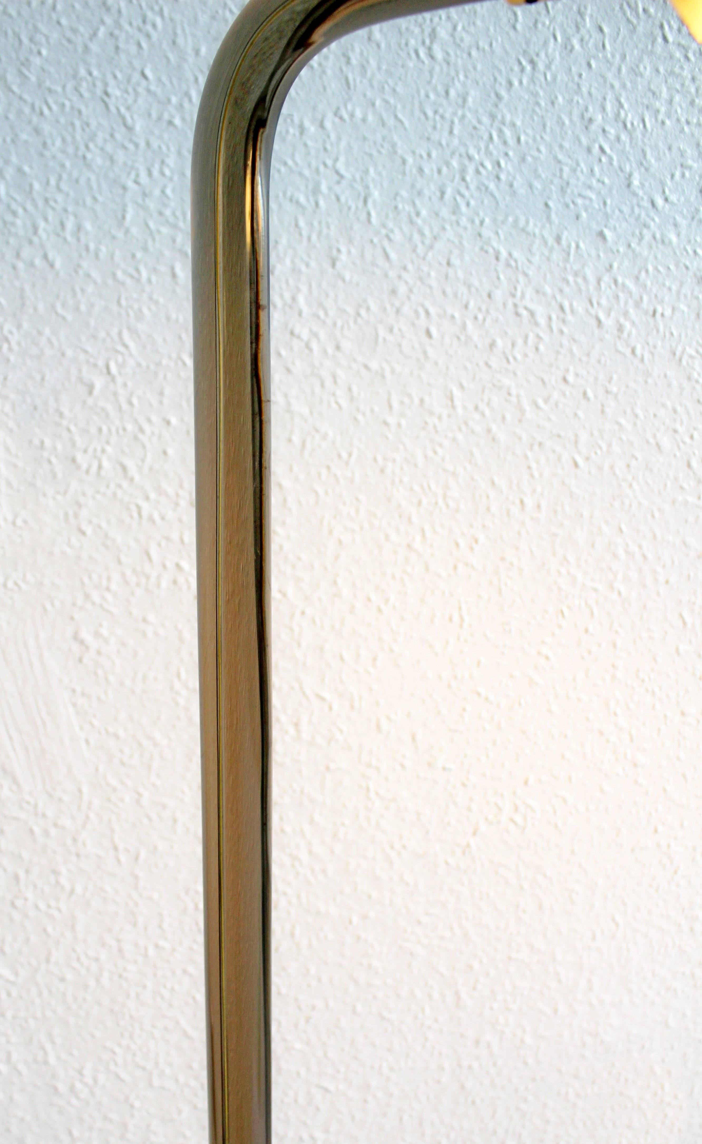 For your consideration is a phenomenal floor lamp, with a cylindrical, smoked lucite stem and brass head and base, by Peter Hamburger for Kovacs, circa the 1970s. In excellent condition. The dimensions are 12