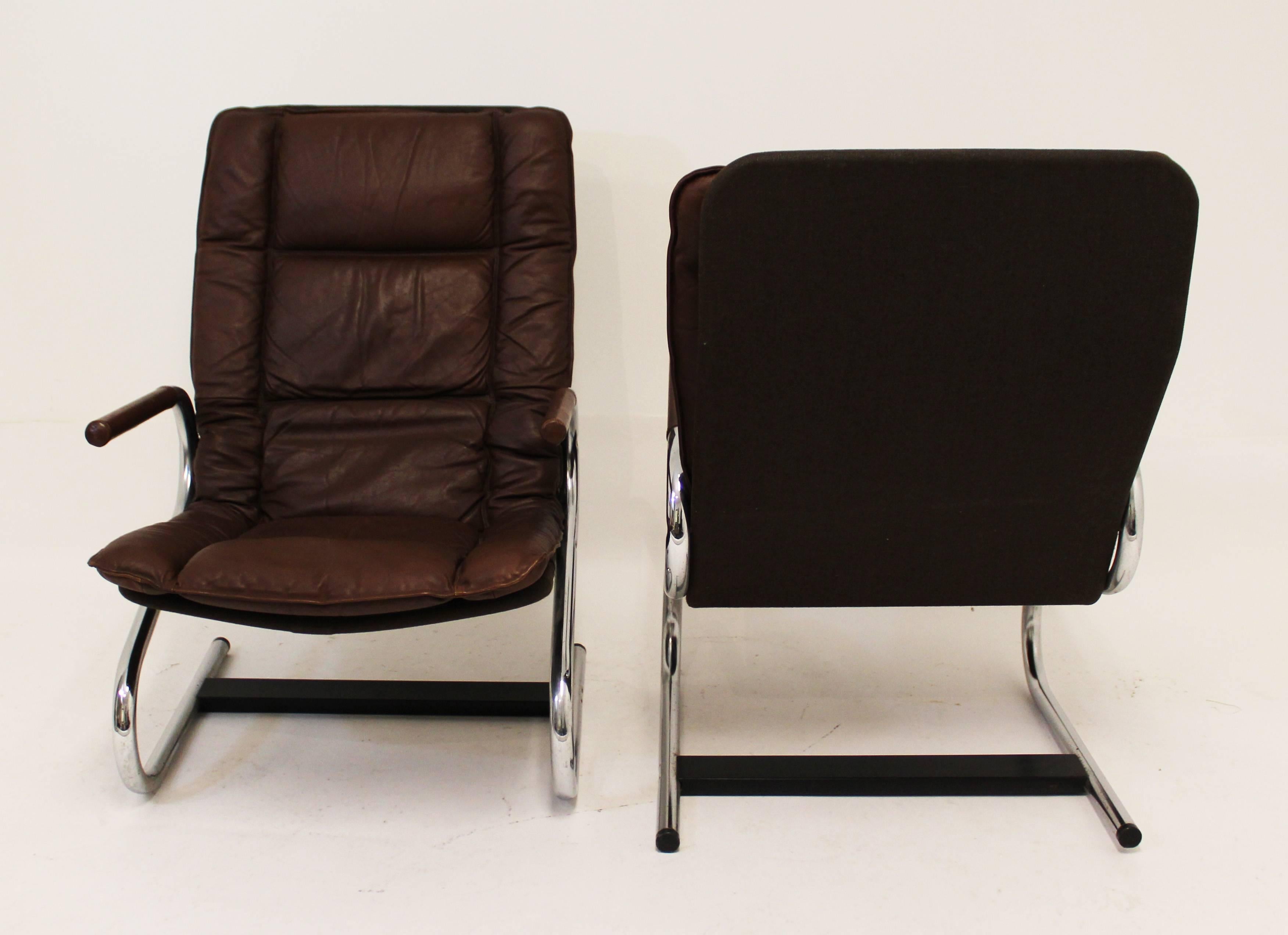 For your consideration is an elegant pair of brown leather and chrome lounge chairs and ottomans by Ingmar Relling for Westnofa in Norway. In excellent condition. The dimensions of the chairs are 24