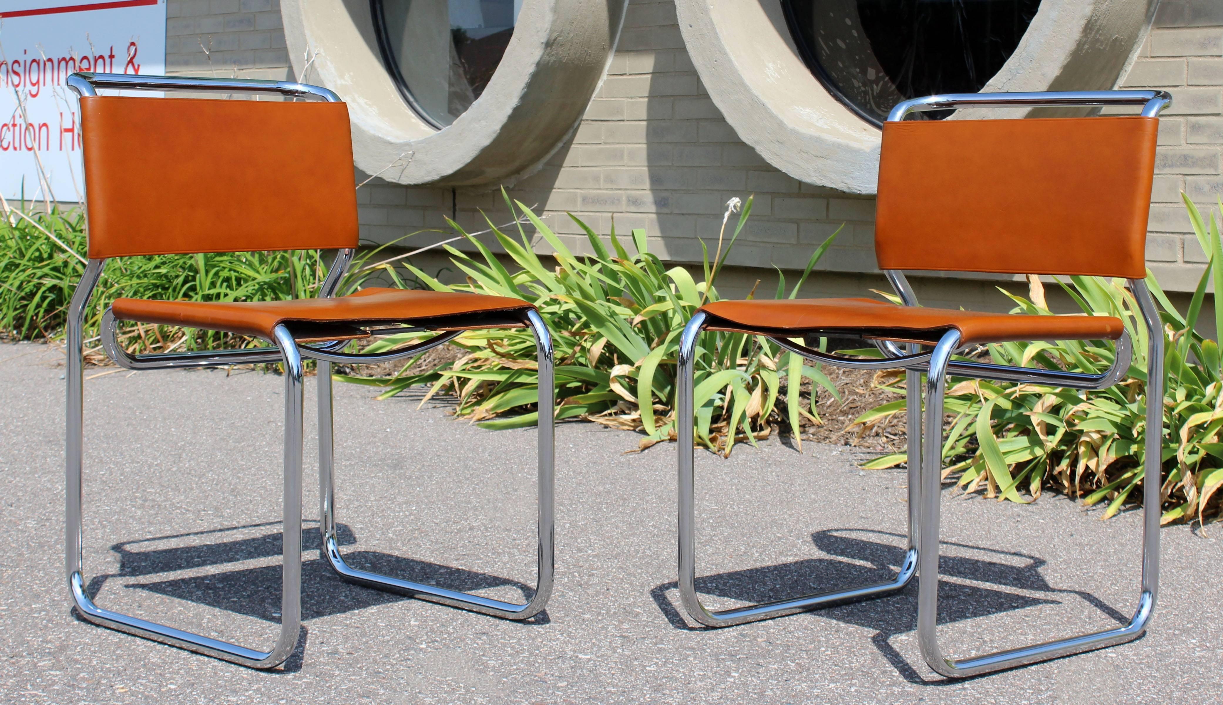 For your consideration is a fantastic set of eight side dining or office chairs, with cantilever chrome bases and orange leather upholstery, designed by Nicos Zographos in the 1960s and manufactured by GF Business Supplies in 1979. In excellent