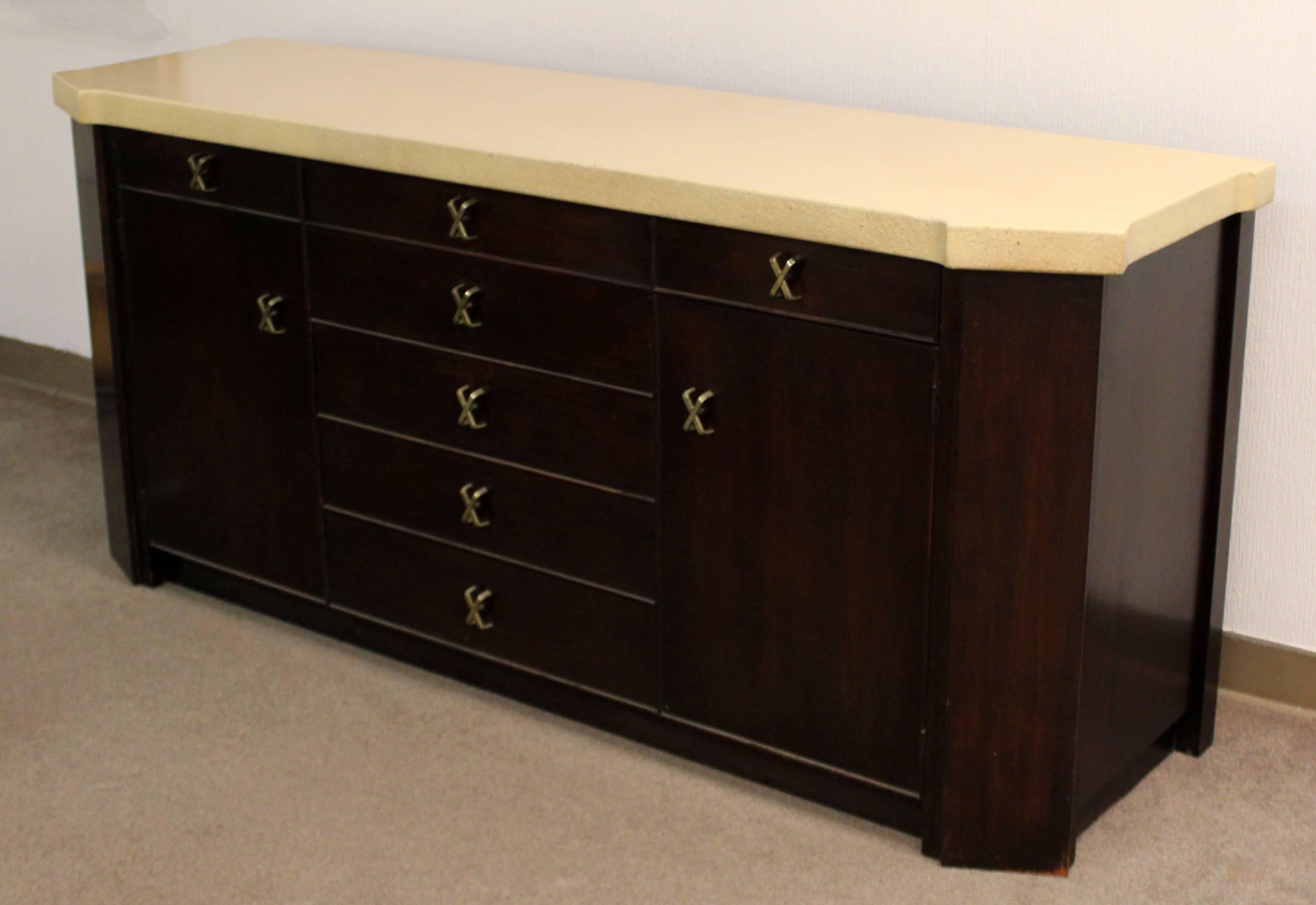 For your consideration is a gorgeous credenza, with a cork top, seven drawers and two shelves, by Paul Frankl for Johnson Furniture, circa the 1950s. In excellent condition. Hutch is also available in a separate posting. The dimensions are 72"
