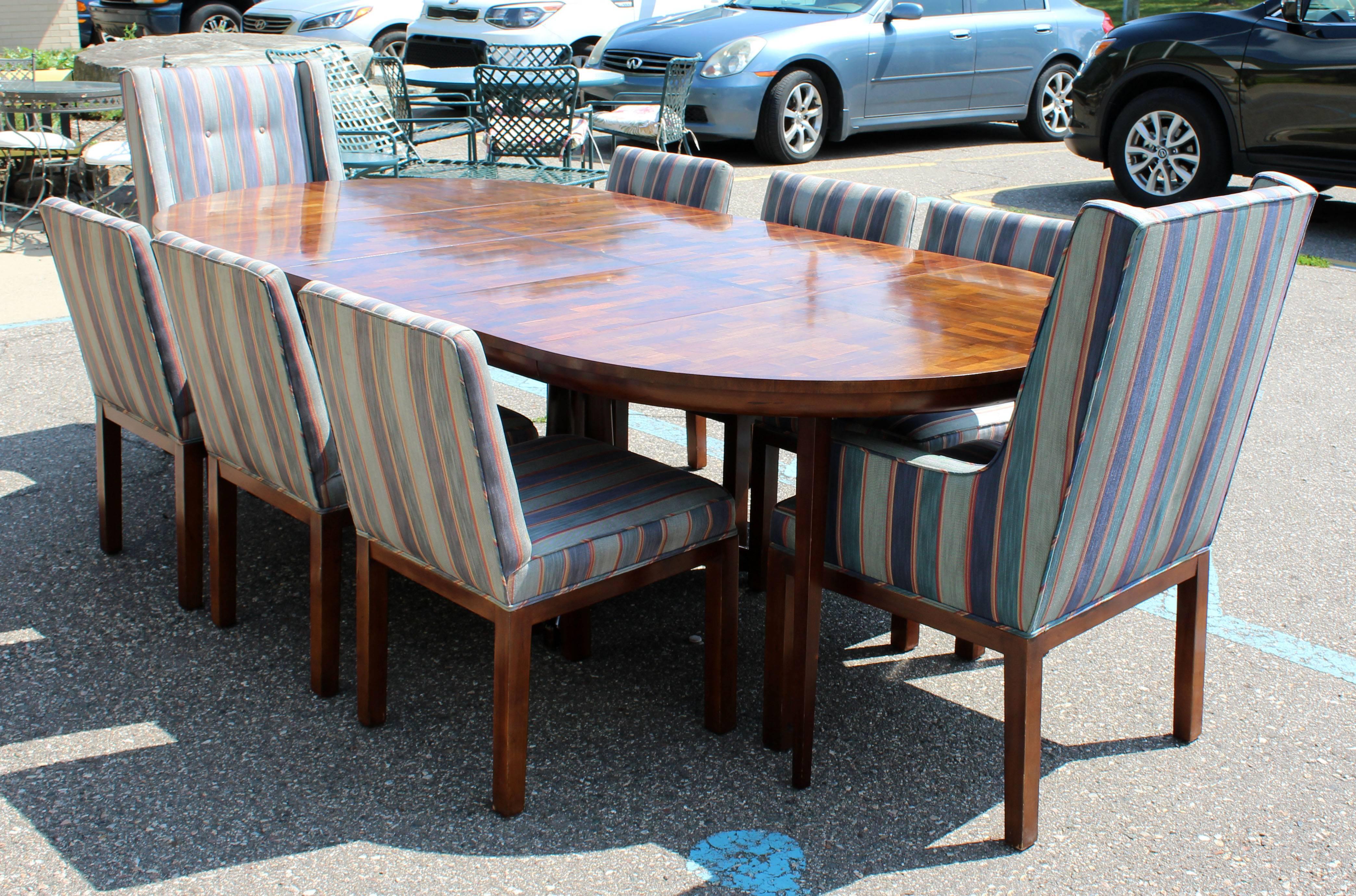 For your consideration is a fabulous dining set, including a parquet wood oval expandable table with three leaves, six side dining chairs and two end armchairs, by Dale Ford for John Widdicomb. In excellent condition. With original tags. Matching