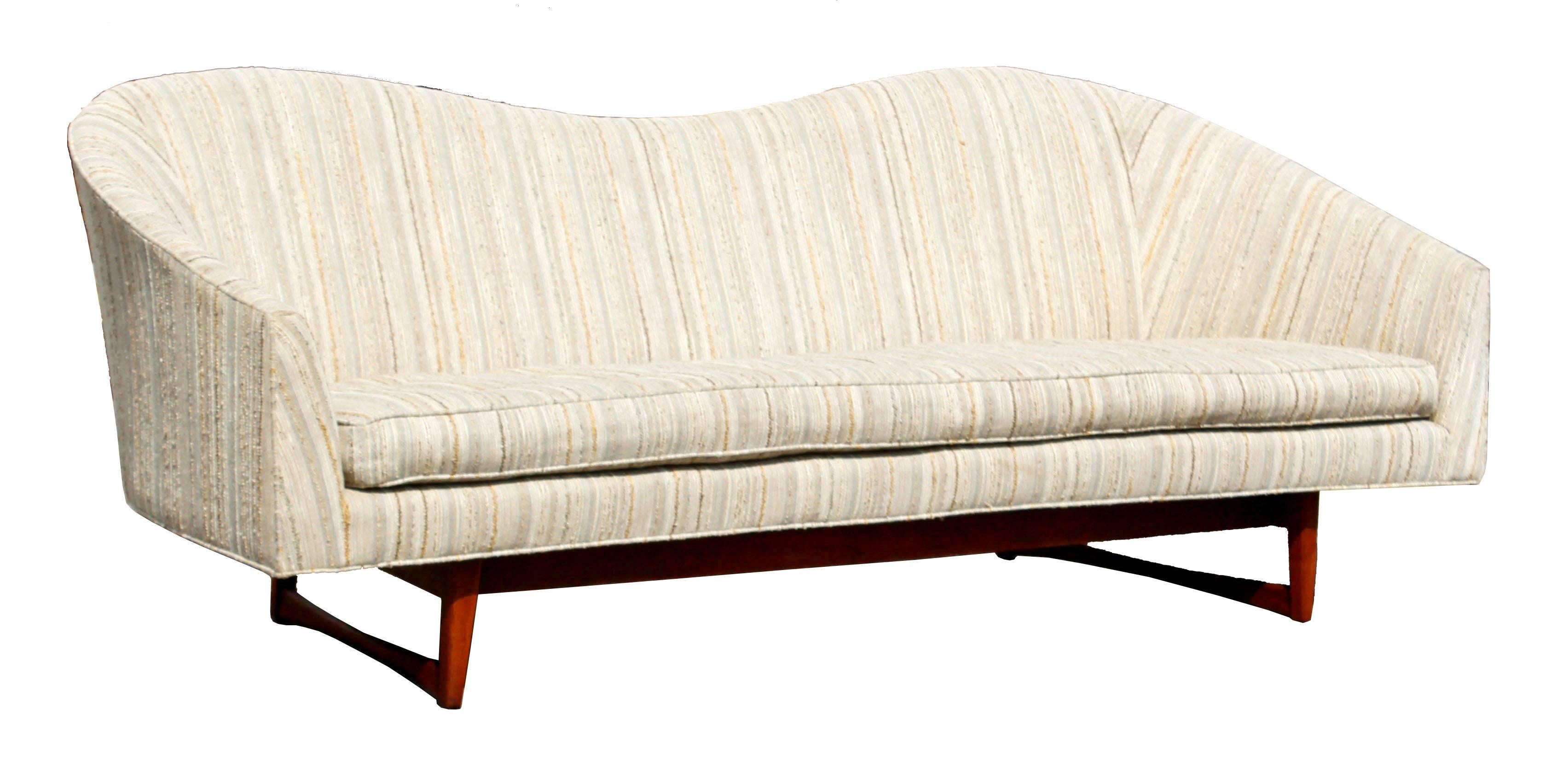 For your consideration is a rare and marvelous, walnut wood base sofa by Lawrence Peabody for Richard Nemschoff. In excellent condition. The dimensions are 85