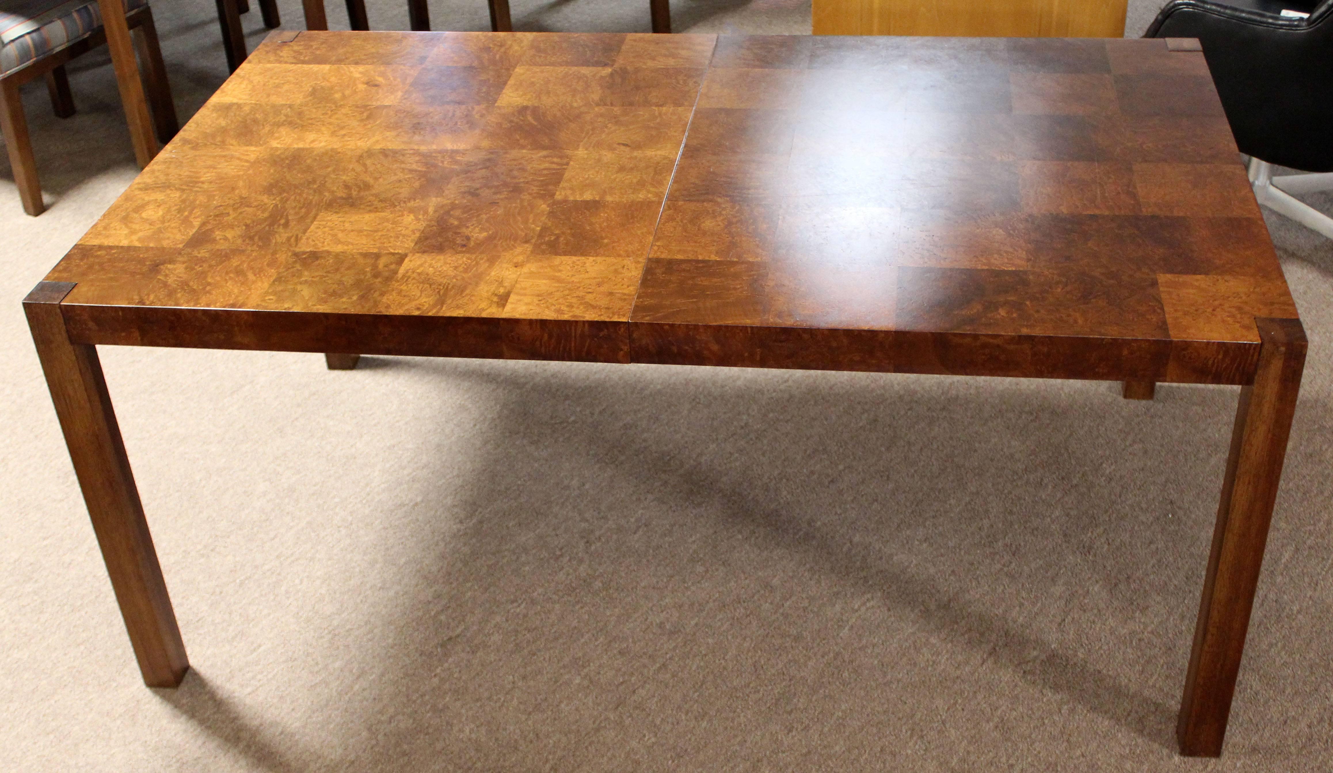 For your consideration is an incredible dining table, made of burled walnut, with two leaves, by Milo Baughman. In excellent condition. The dimensions are 65