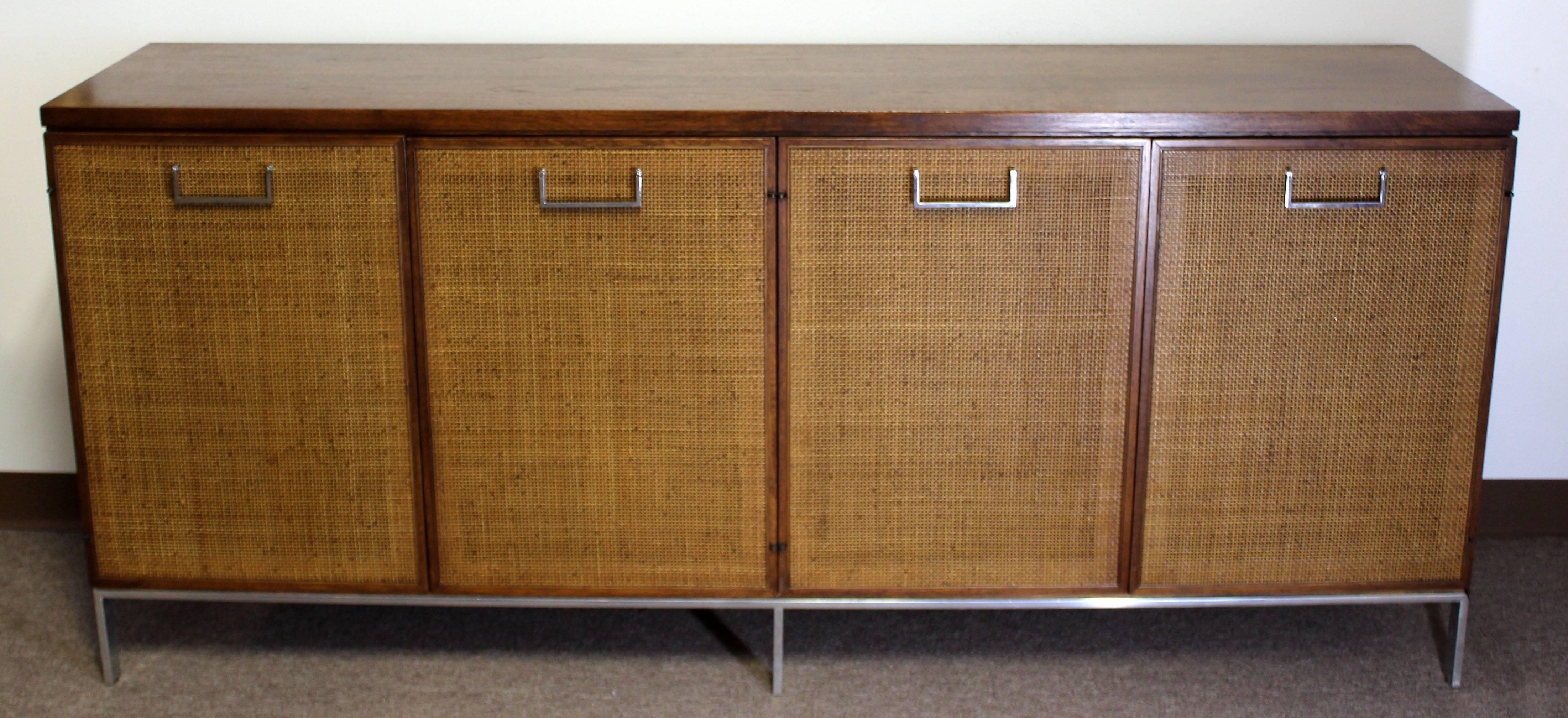 For your consideration is a gorgeous, cane and chrome, server sideboard credenza with two drawers for serving utensils and silverware, by Milo Baughman for Founders, circa the 1970s. In excellent condition. The dimensions are 77.5