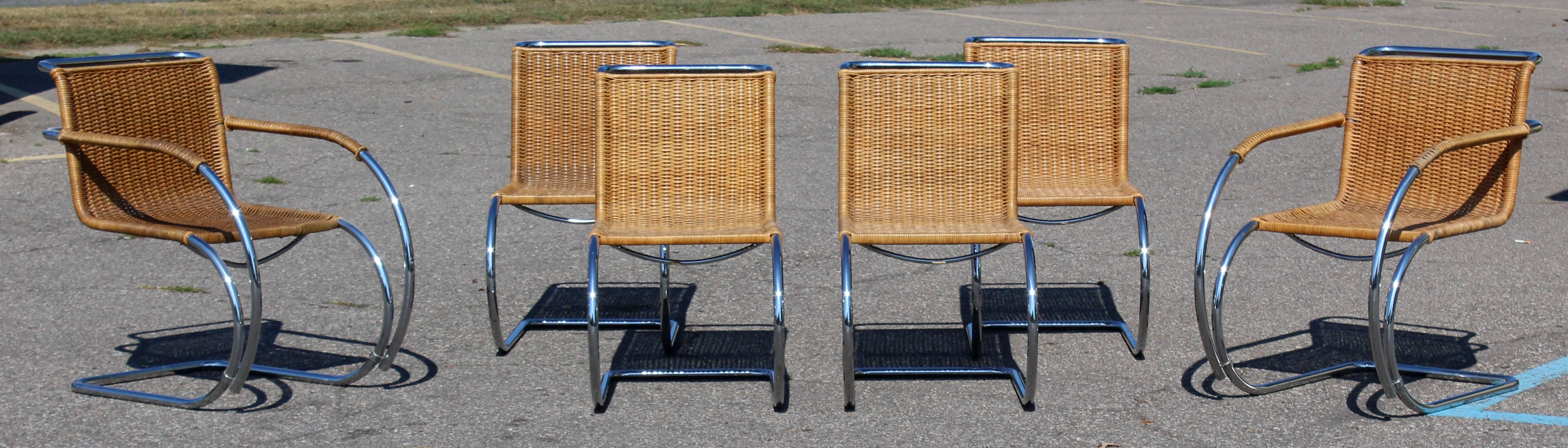 For your consideration is a gorgeous set of six dining chairs, two arm and four side, made of cane and chrome, by Mies van der Rohe MR10 for Stendig, Denmark, circa the 1970s. Just back from being professionally redone. In excellent condition. The