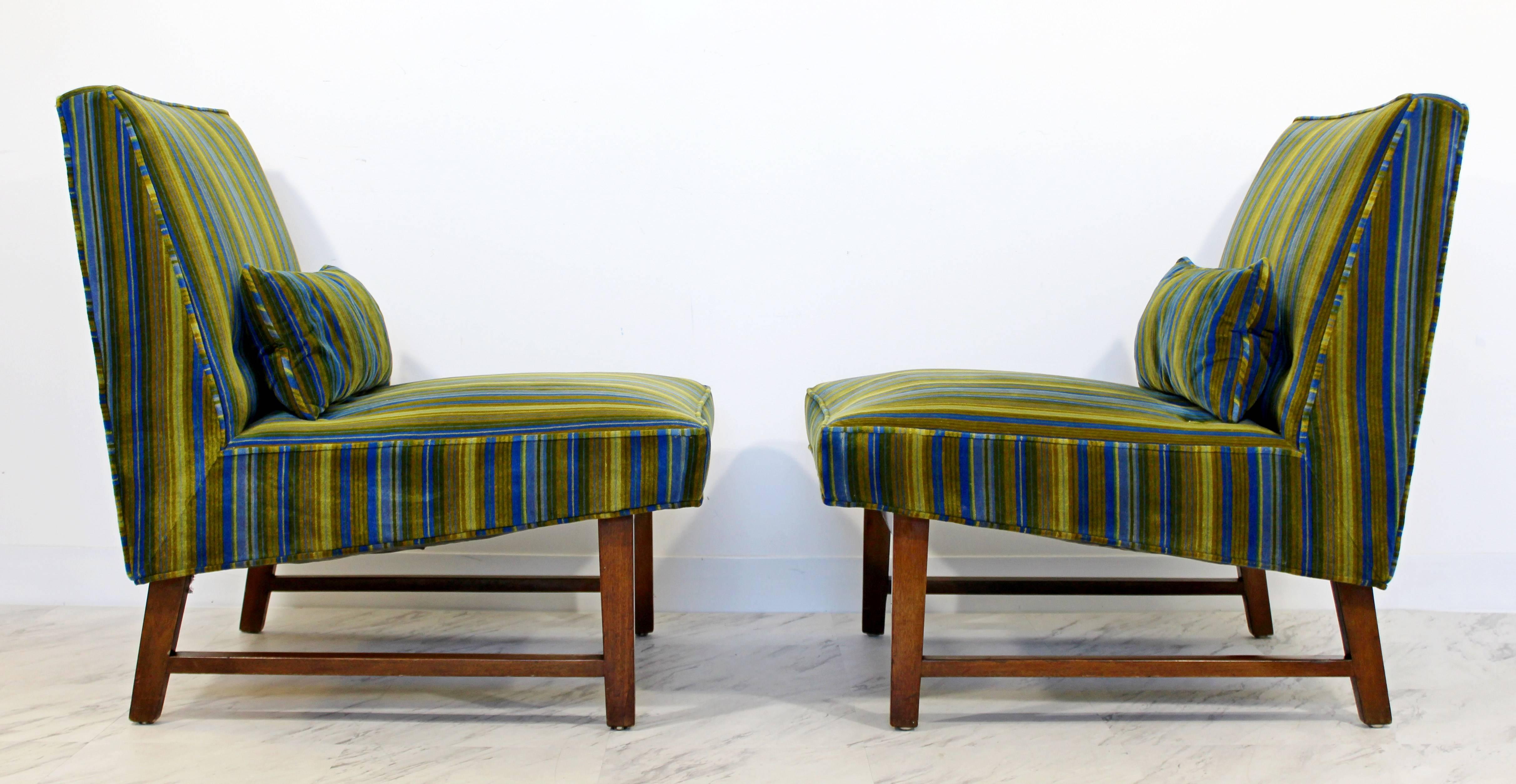 For your consideration is a magnificent pair of Edward Wormley for Dunbar Model # 127 slipper lounge chairs. The upholstery is attributed to Jack Lenor Larsen and is in mint condition. Base is made of mahogany. They had special slipcovers over the