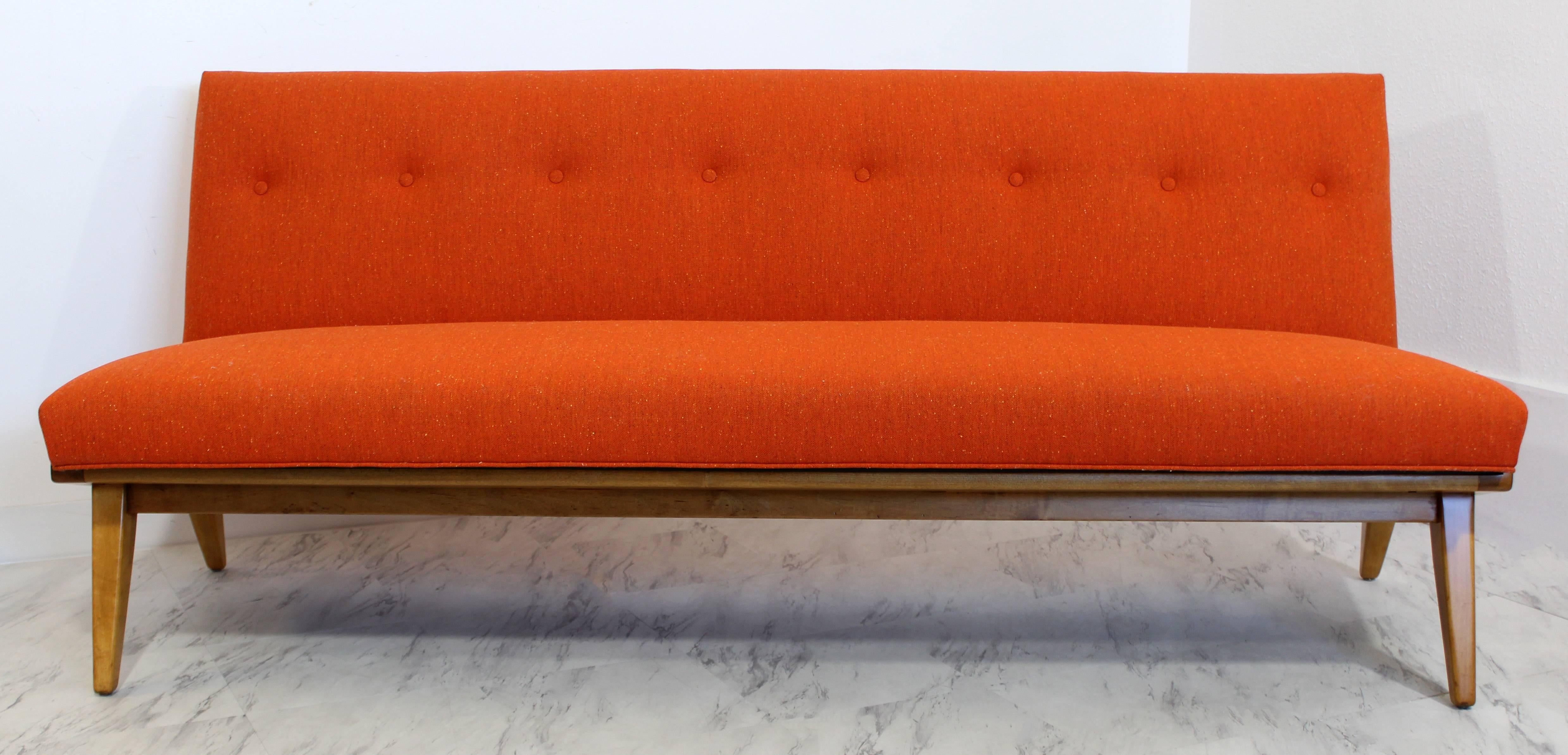 For your consideration is an eye-catching sofa, with a vibrant orange fabric, by Jens Risom for Knoll. Just back from the base being professionally refinished and the sofa being professionally reupholstered in beautiful vintage fabric. This amazing