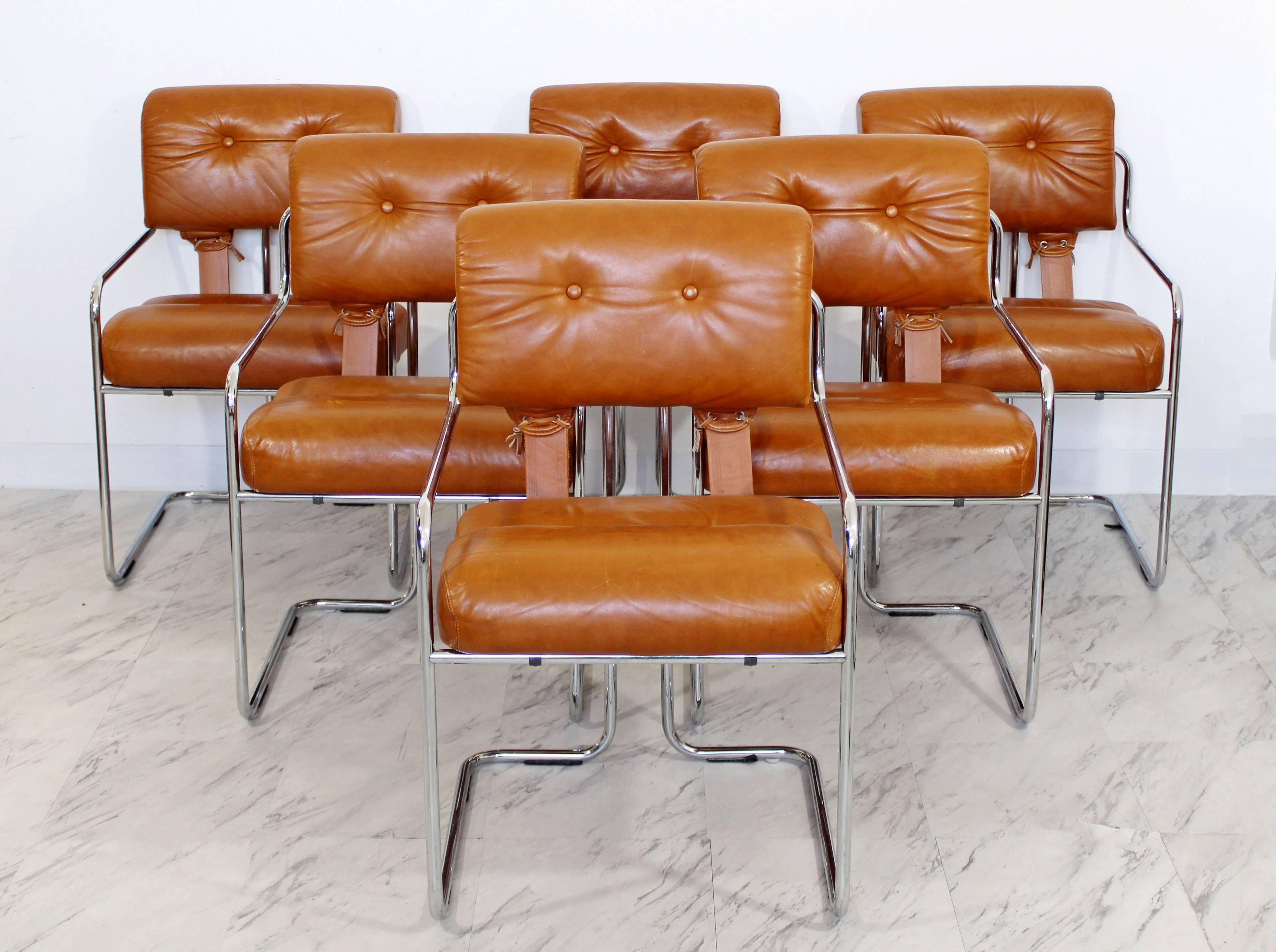 For your consideration is a full set of six, original, chrome and brown leather, dining armchairs by Mariani, circa 1970s, Italian. In excellent condition. The dimensions are 20.5" W x 23" D x 33" B.H. x 18" S.H.