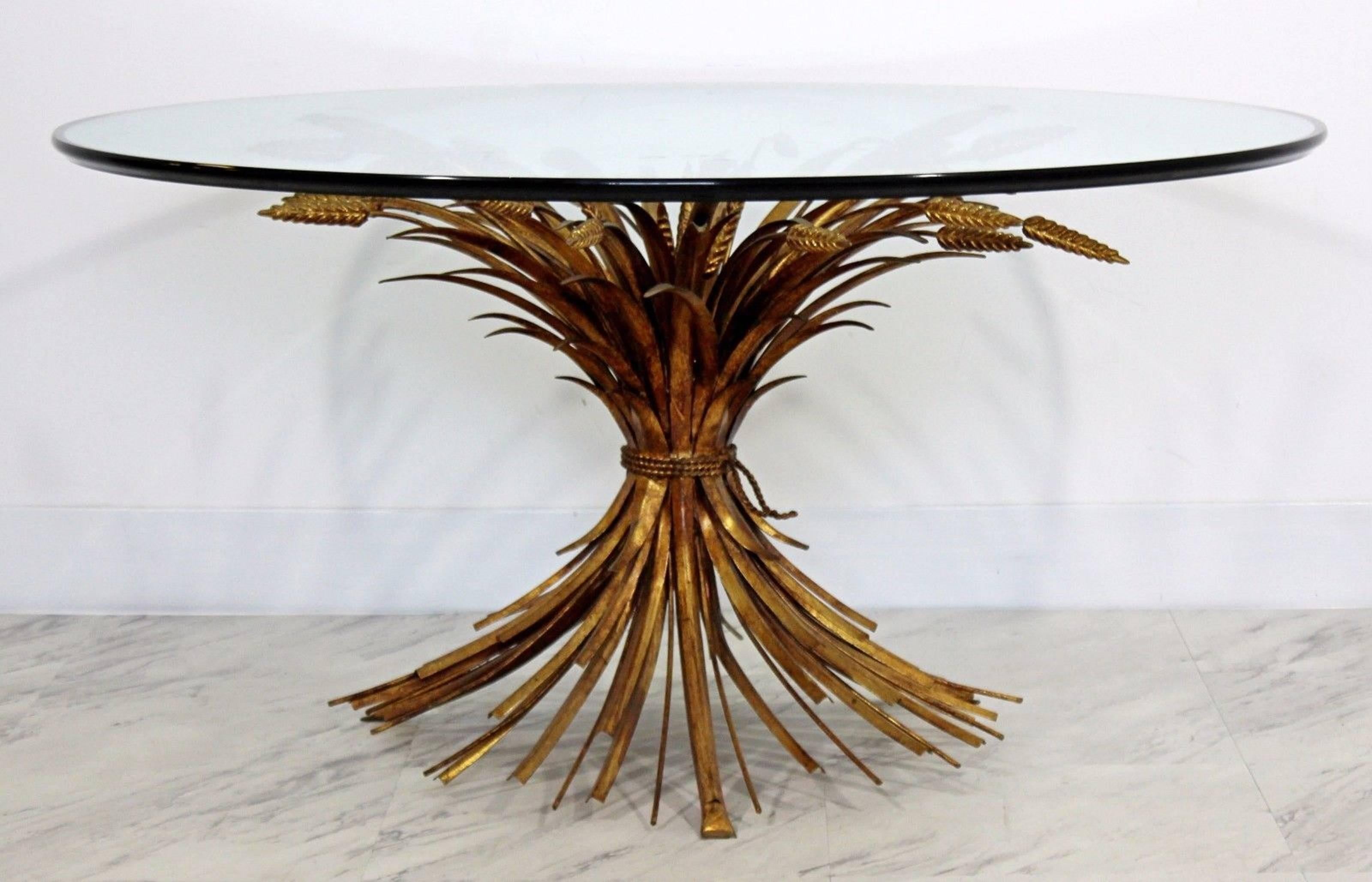 For your consideration is a lovely Italian gold gilt Hollywood Regency wheat sheaf, coffee table, with a round, glass top. In excellent condition. The dimensions are 36