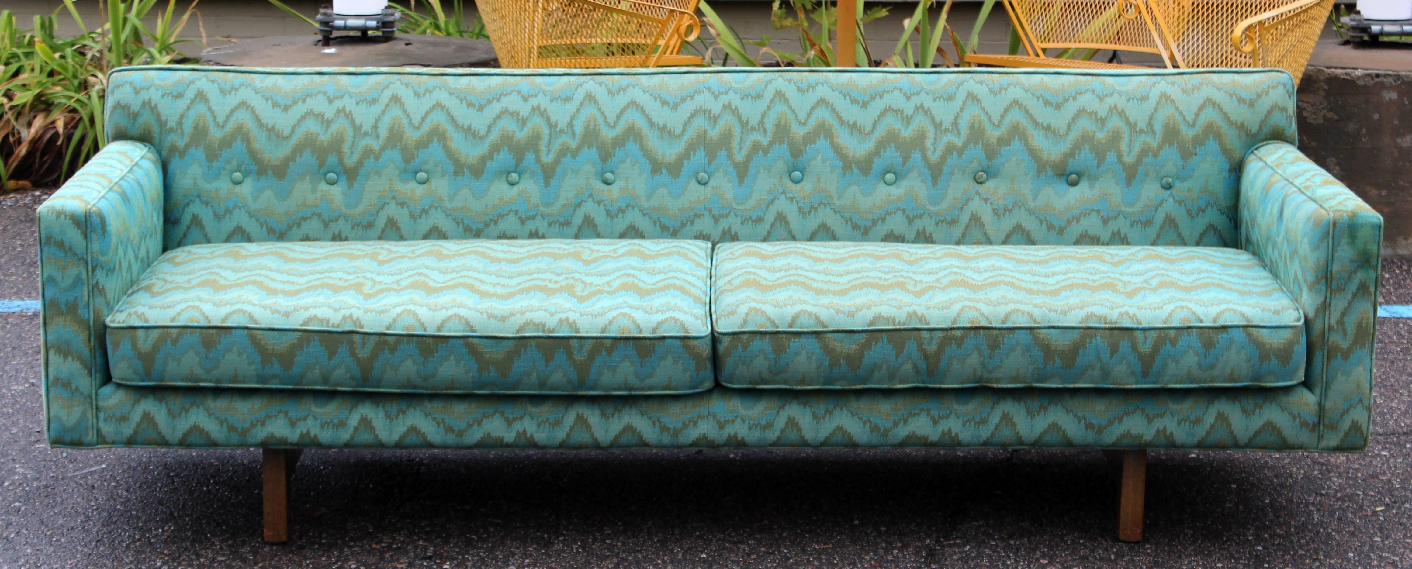 For your consideration is a truly magnificent, bracket sofa, designed by Edward Wormley for Dunbar and bearing a stitched tag, circa 1950s. In excellent condition. The dimensions are 84
