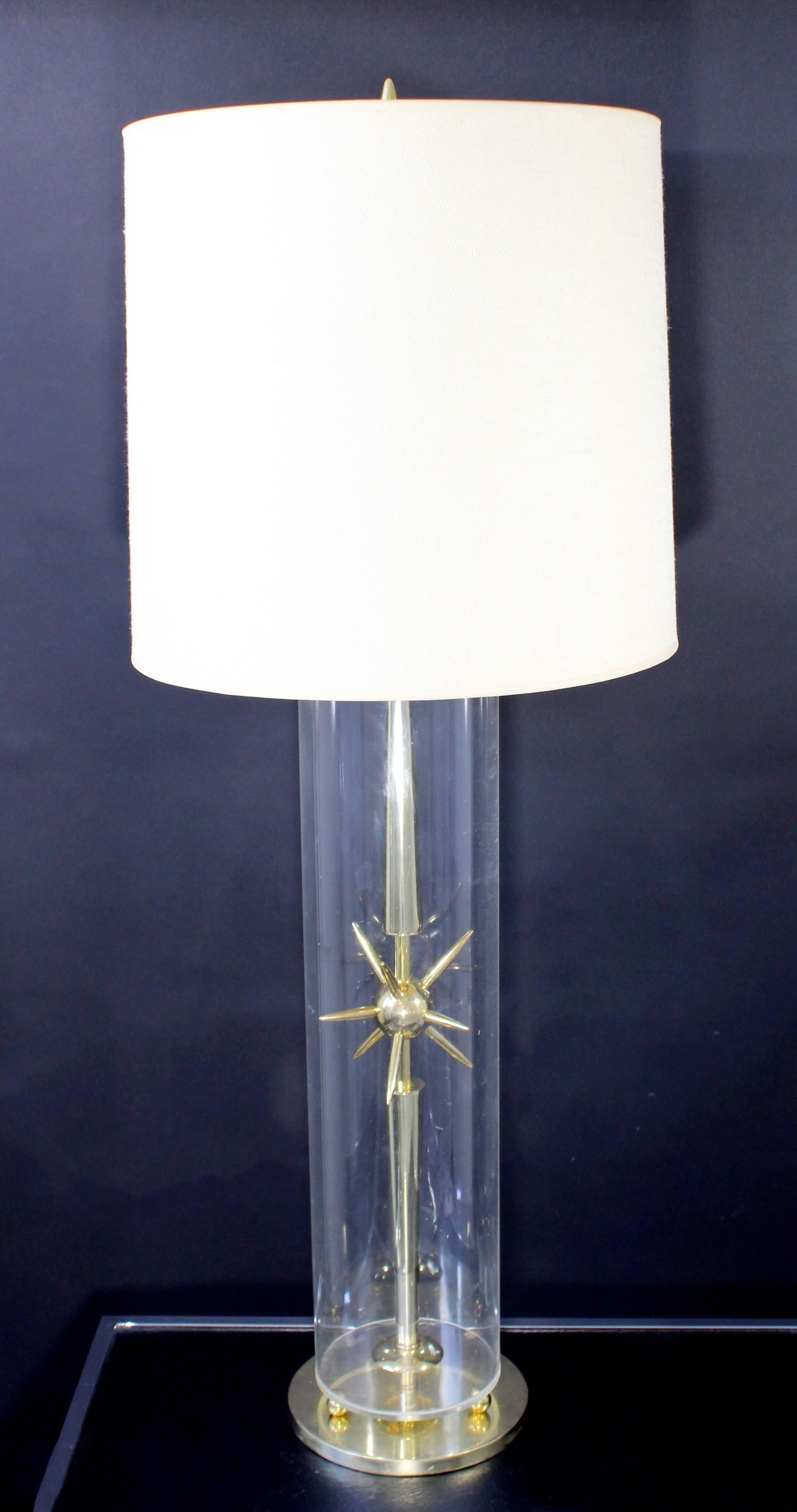 For your consideration is a mod and elegant, Sputnik table lamp, made of brass and glass, from Mutual Sunset Lamp Co. Includes original shade and finial. In excellent condition. The dimensions of the shade are 15