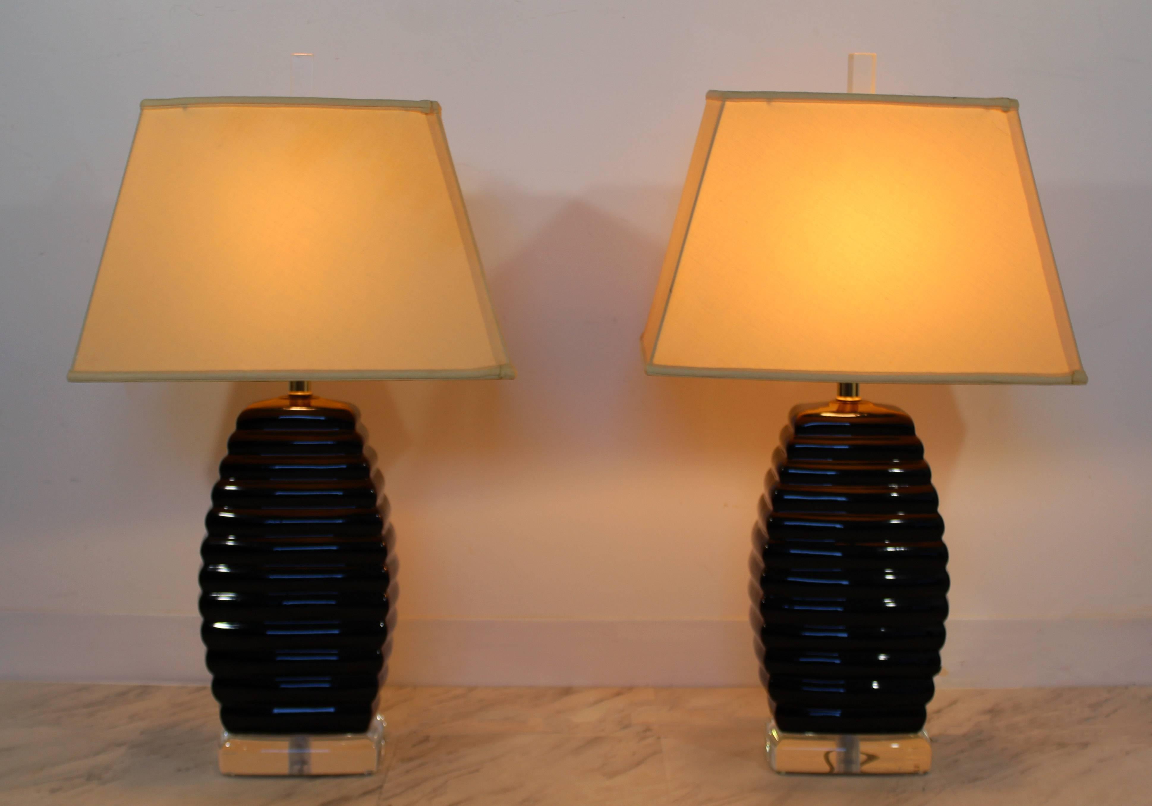 For your consideration is a gorgeous pair of Lucite table lamps, in the beehive style, with their original Lucite finials, by Bauer. In excellent condition. The dimensions of the lamps are 8.5