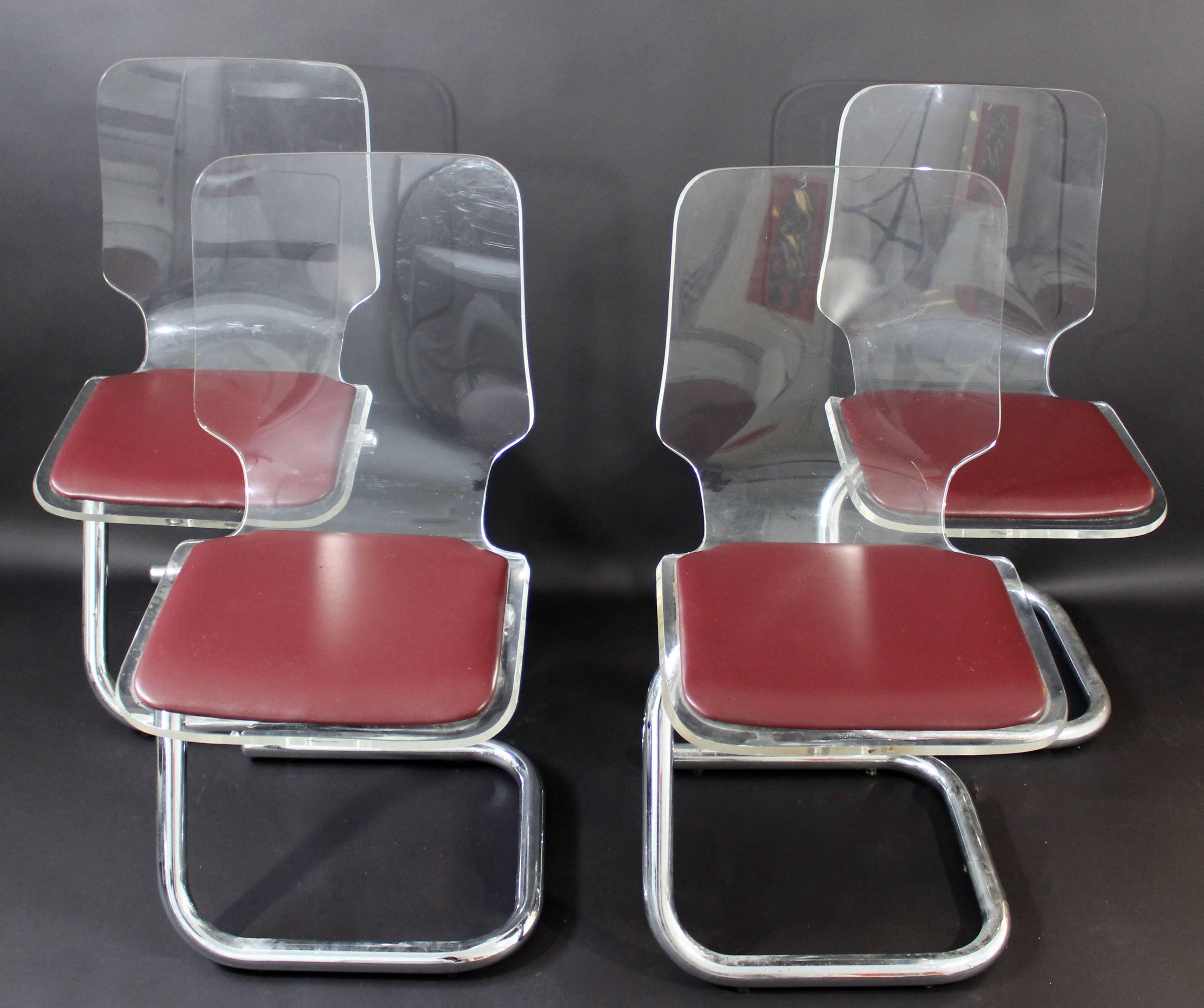 For your consideration is a fantastic set of four, Lucite and tubular chrome, side dining chairs, by Hill Manufacturing Corporation, circa the 1970s. Designed by Luigi Bardini Italy. In excellent condition. The dimensions are 16