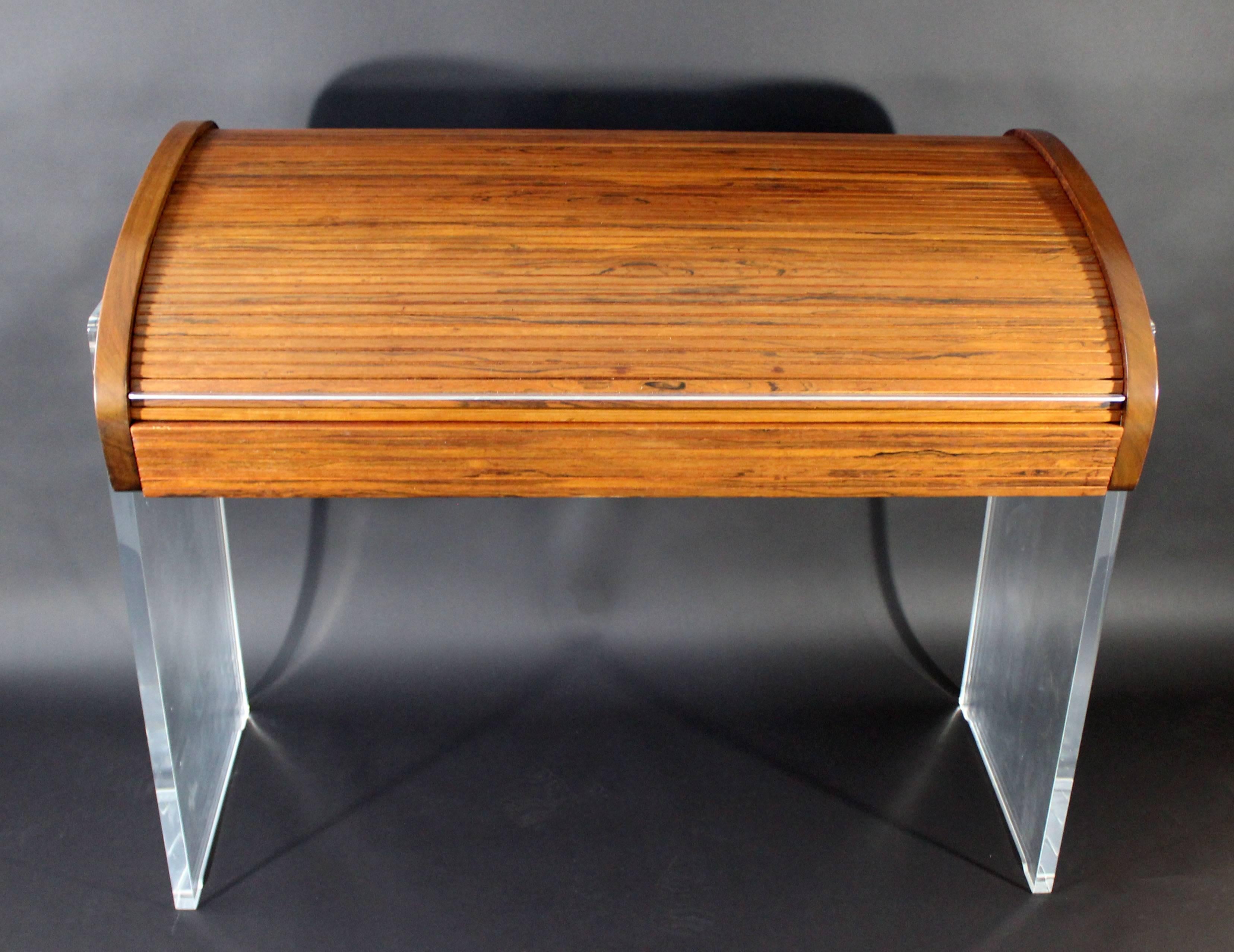 For your consideration is an utterly fabulous, Lucite and rosewood, roll-top desk, by Vladimir Kagan, circa the 1960s. In excellent condition. Original tags. The dimensions are 44