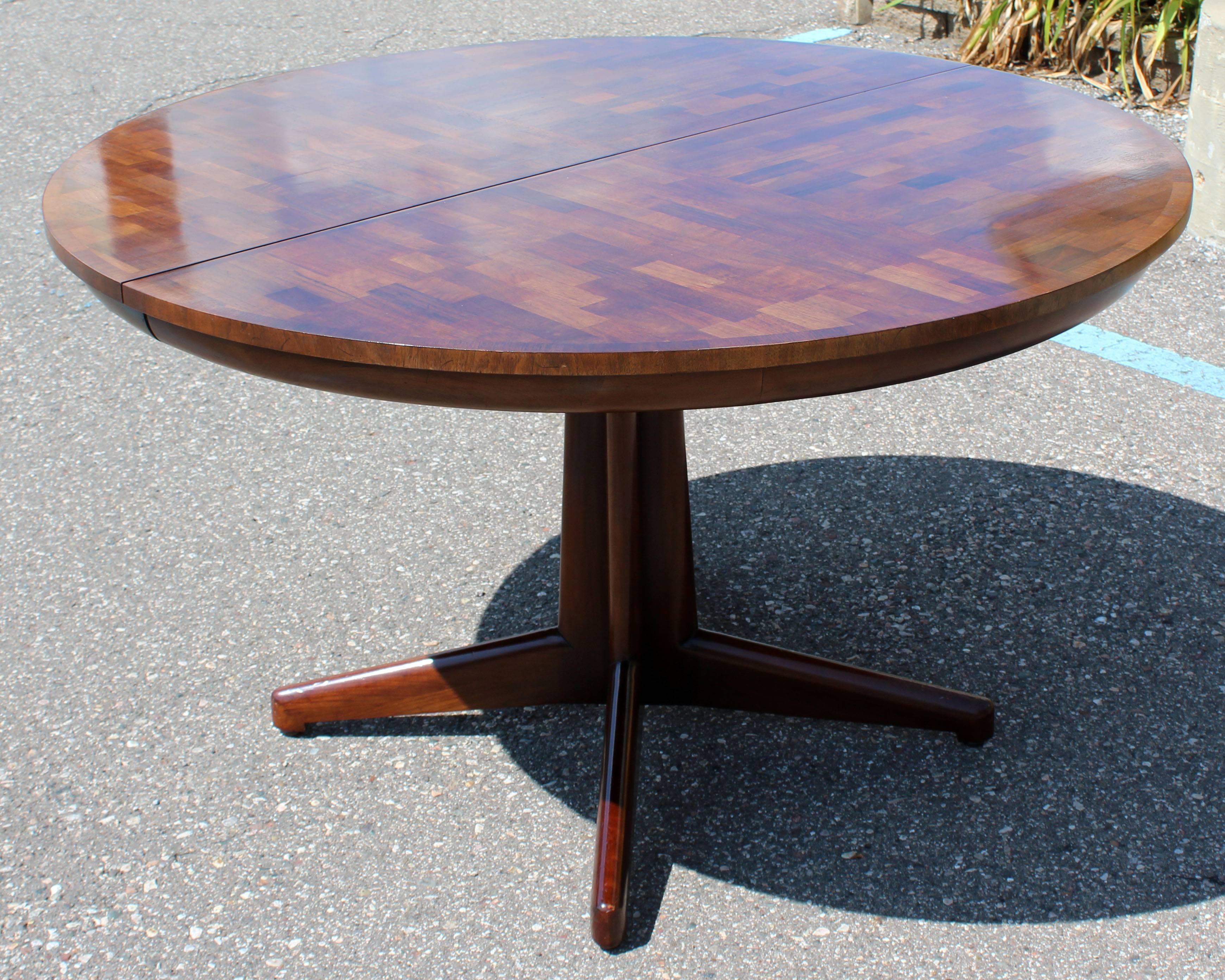 For your consideration is a fabulous, parquet wood, oval, expandable, dining table, with three leaves, by Dale Ford for Widdicomb Furniture, circa the 1960s. In excellent condition. Eight side dining chairs available in separate listing. The