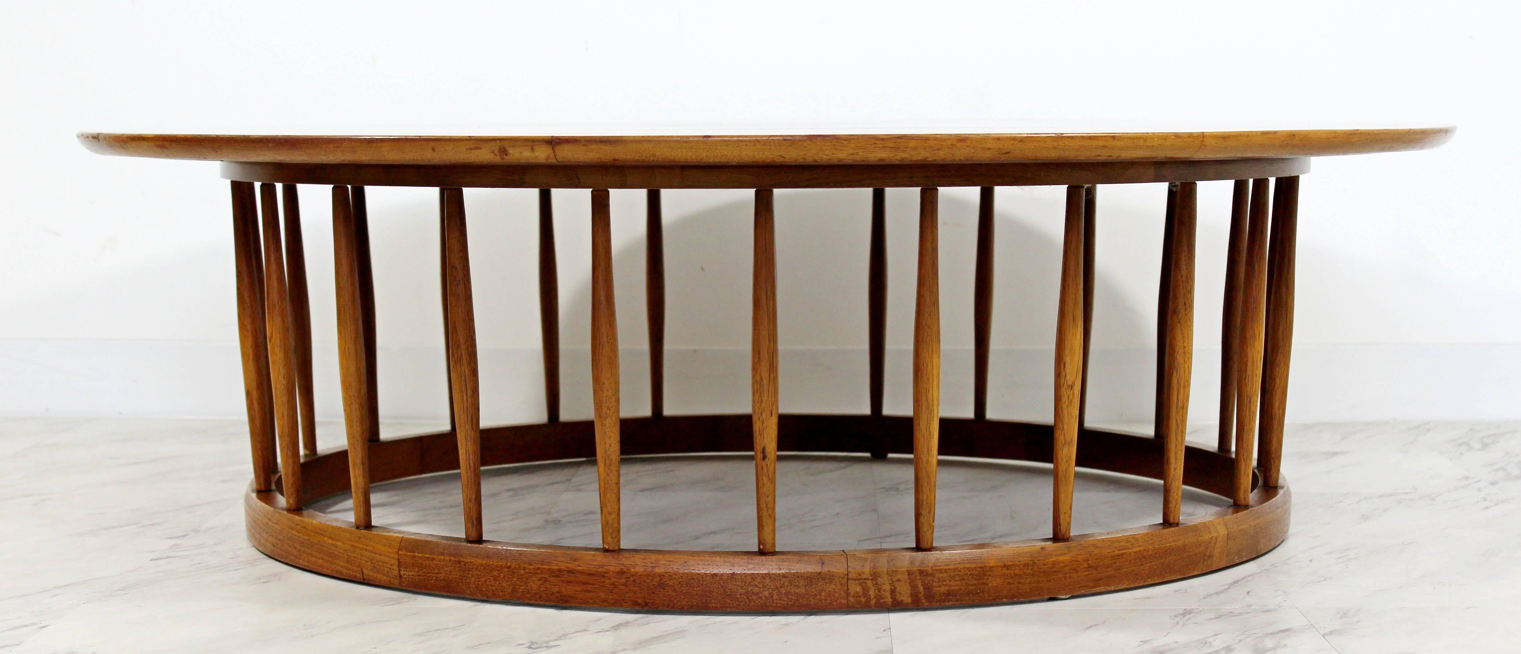 For your consideration is a magnificent, circular, walnut spindle base, coffee table by Drexel, circa the 1950s. In excellent condition. The dimensions are 48
