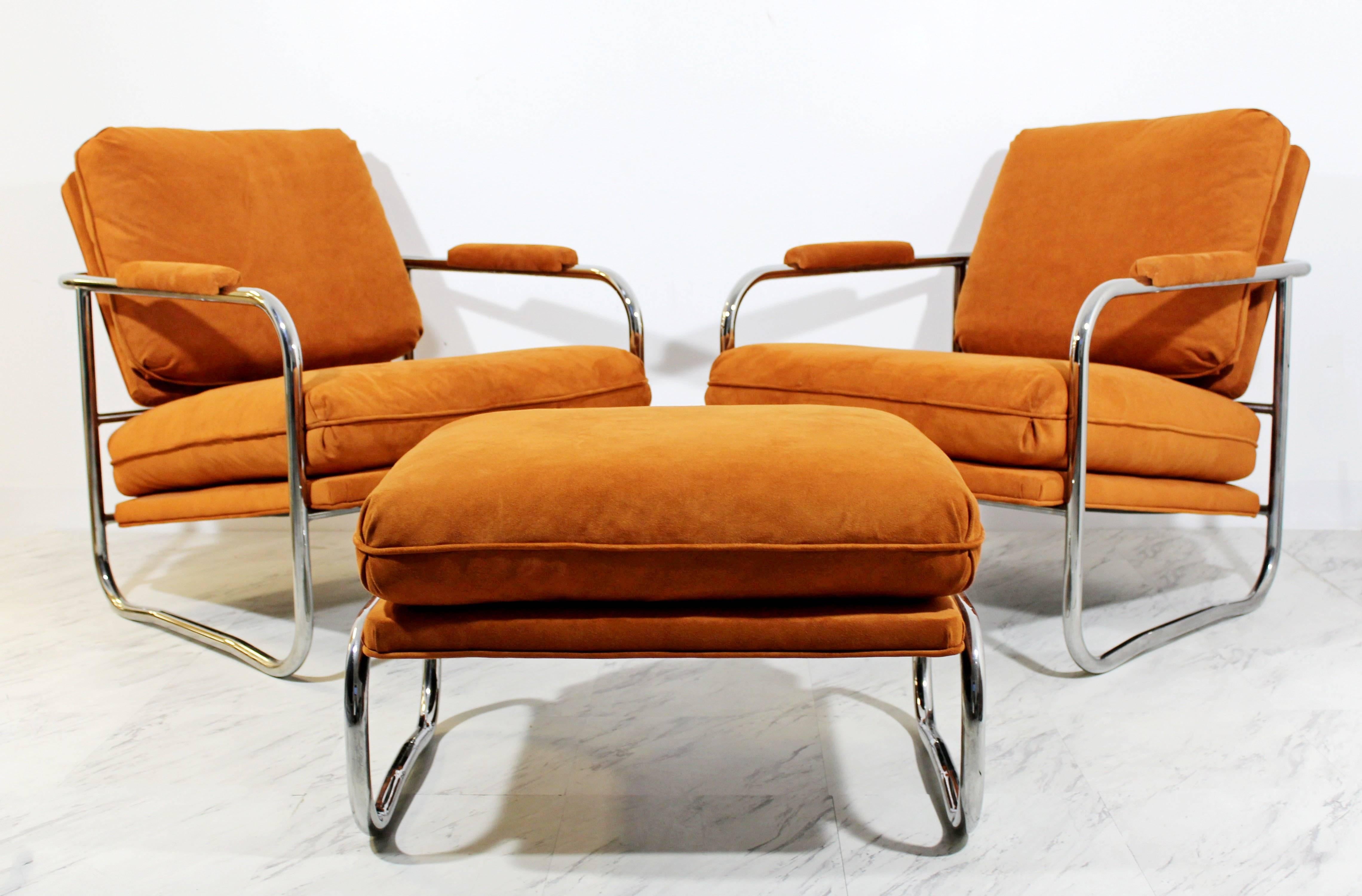 For your consideration is a remarkable pair of rare, tubular chrome, lounge chairs, and matching ottoman by Milo Baughman. The interesting cushions sit on the base and come completely off for easy transfer and storage. In excellent condition. The