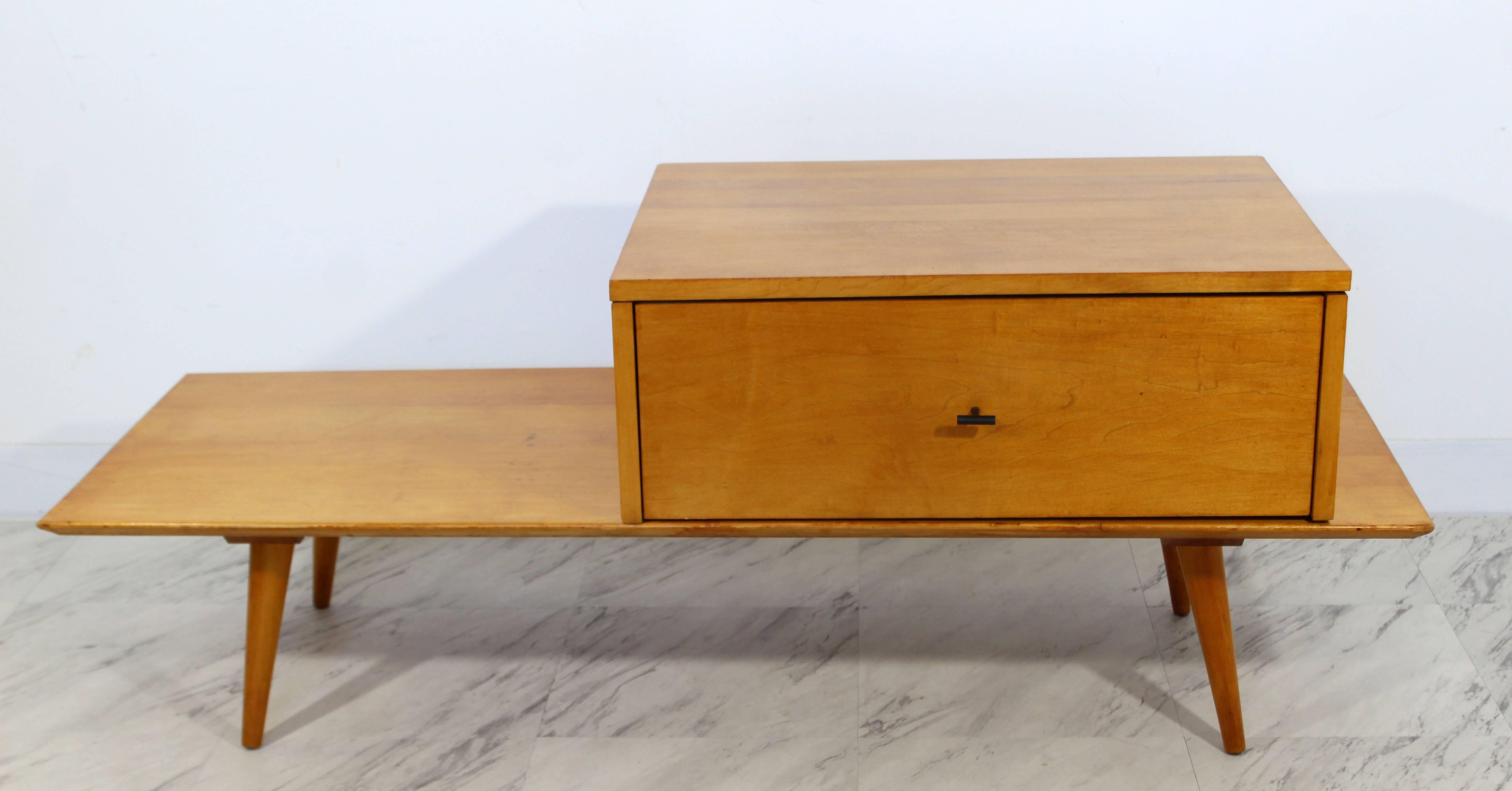 For your consideration is an incredible, coffee table or bench with drawer, made of solid maple and with tapered legs, by Paul McCobb for Winchendon, circa 1960s. In excellent condition. The dimensions of the table are 48