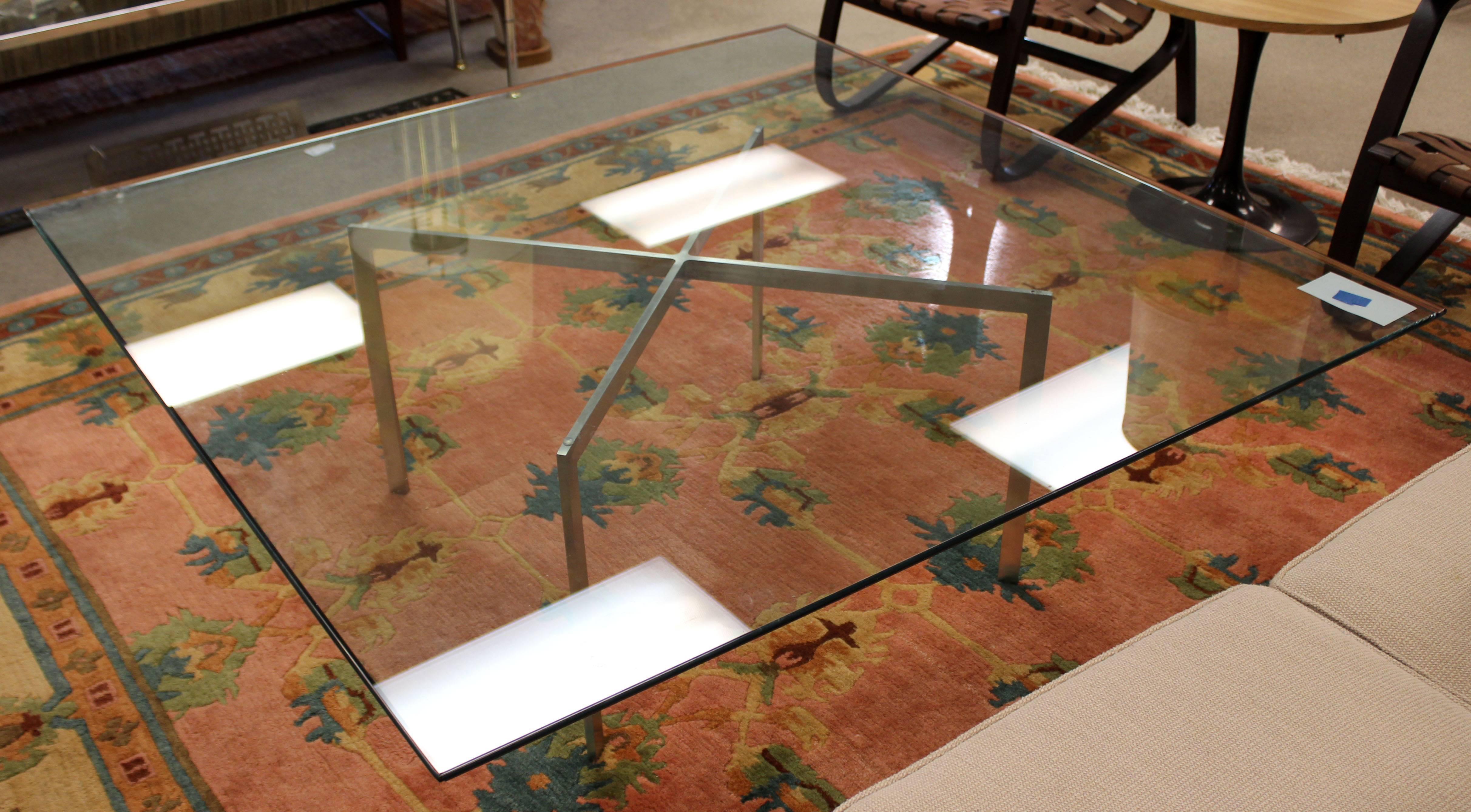 For your consideration is a gorgeous, brushed, stainless steel, coffee table, with a square, bevelled glass top called the Barcelona, table by Mies van der Rohe. In excellent condition. The dimensions are 54