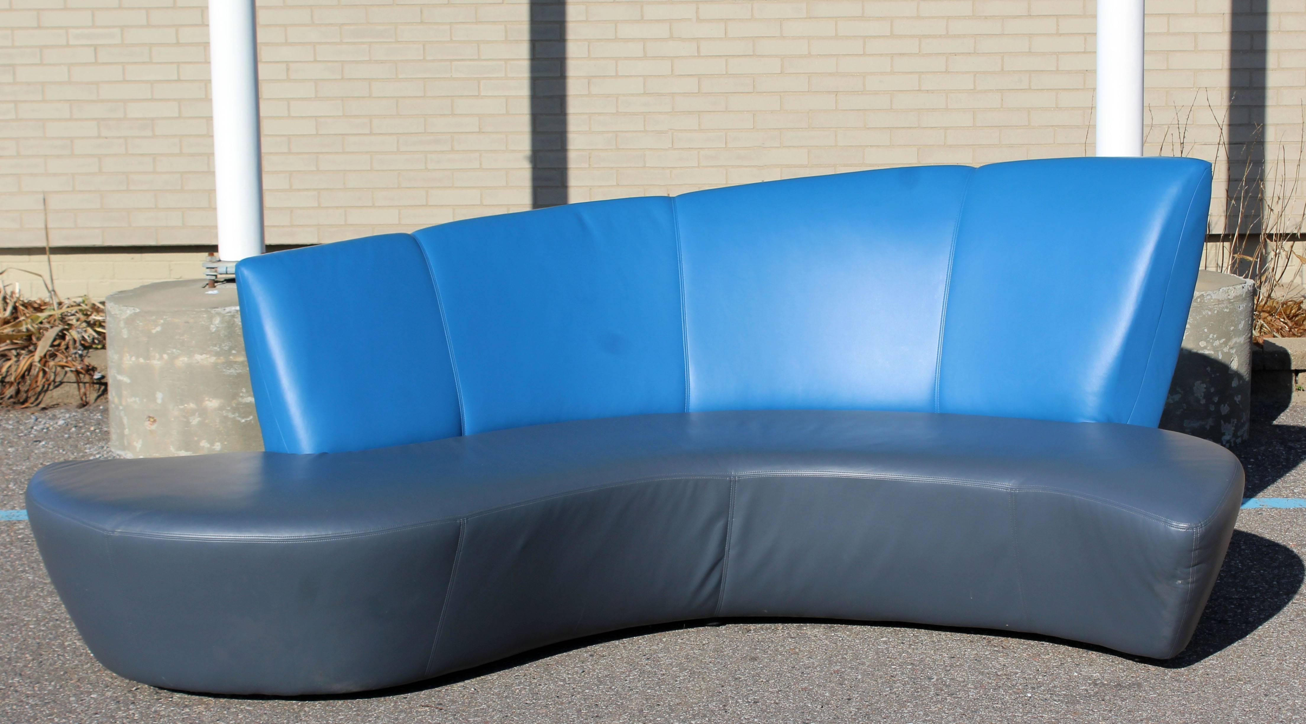For your consideration is a phenomenal, curved, Balboa sofa, with blue and gray leather upholstery, by Vladimir Kagan for Weiman, circa the 1970s. In excellent condition. The dimensions are 96