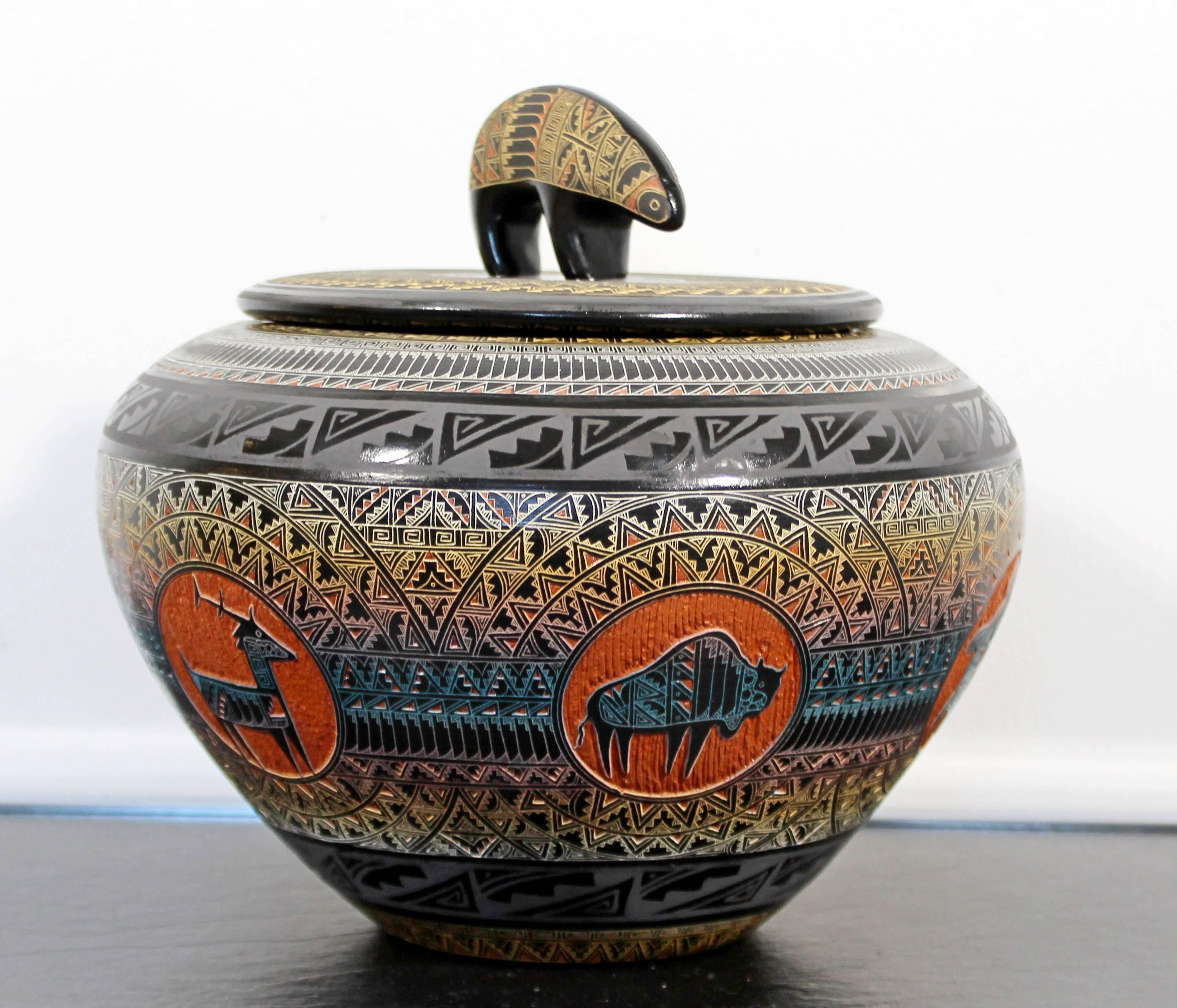 Marvin Blackmore was born in Farmington, New Mexico. Throughout the years he has mastered the art of pottery and is always innovating new ideas. His pottery reflects multiple layers of clay slips in which he etches through to each wanted layer. The