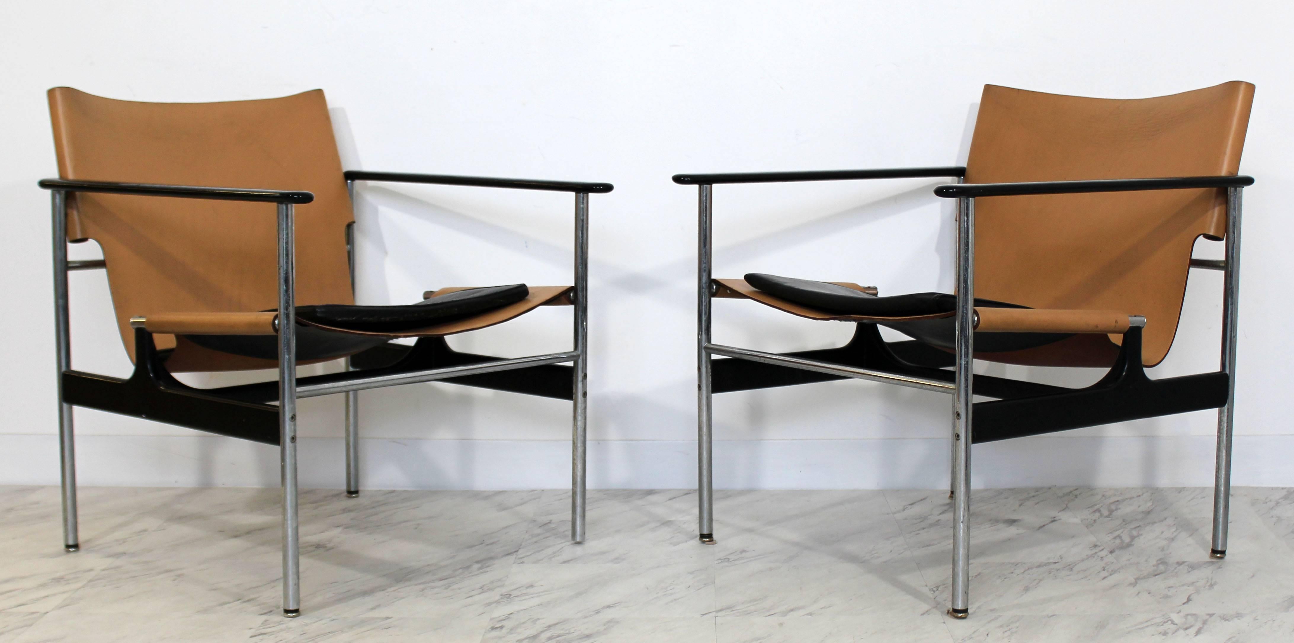 For your consideration is a unique pair of arm chairs, by Charles Pollock for Knoll Model #657, on chrome frames and with brown leather upholstery. In good vintage condition. The dimensions are 25