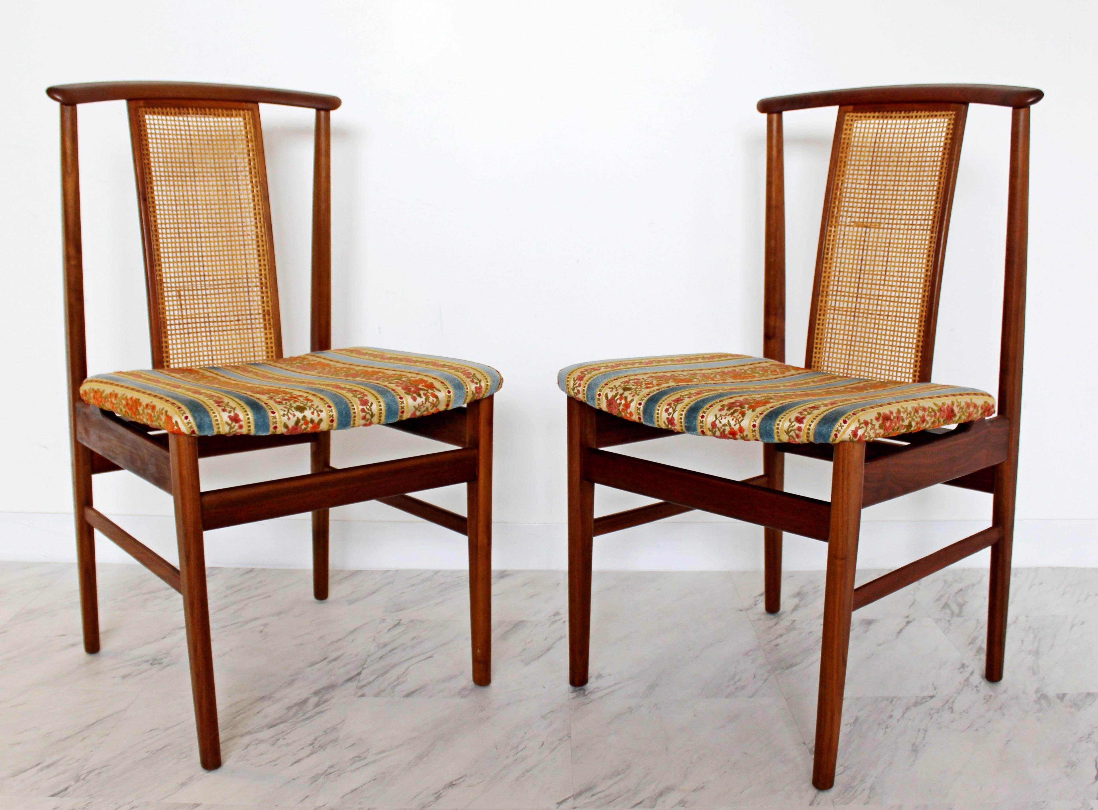 For your consideration is a stunning, set of eight, teak and cane, side dining chairs, by Folke Olsson for Swedish company DUX, circa 1960s. In excellent condition. Chairs can be professionally reupholstered for $400. The dimensions are 19