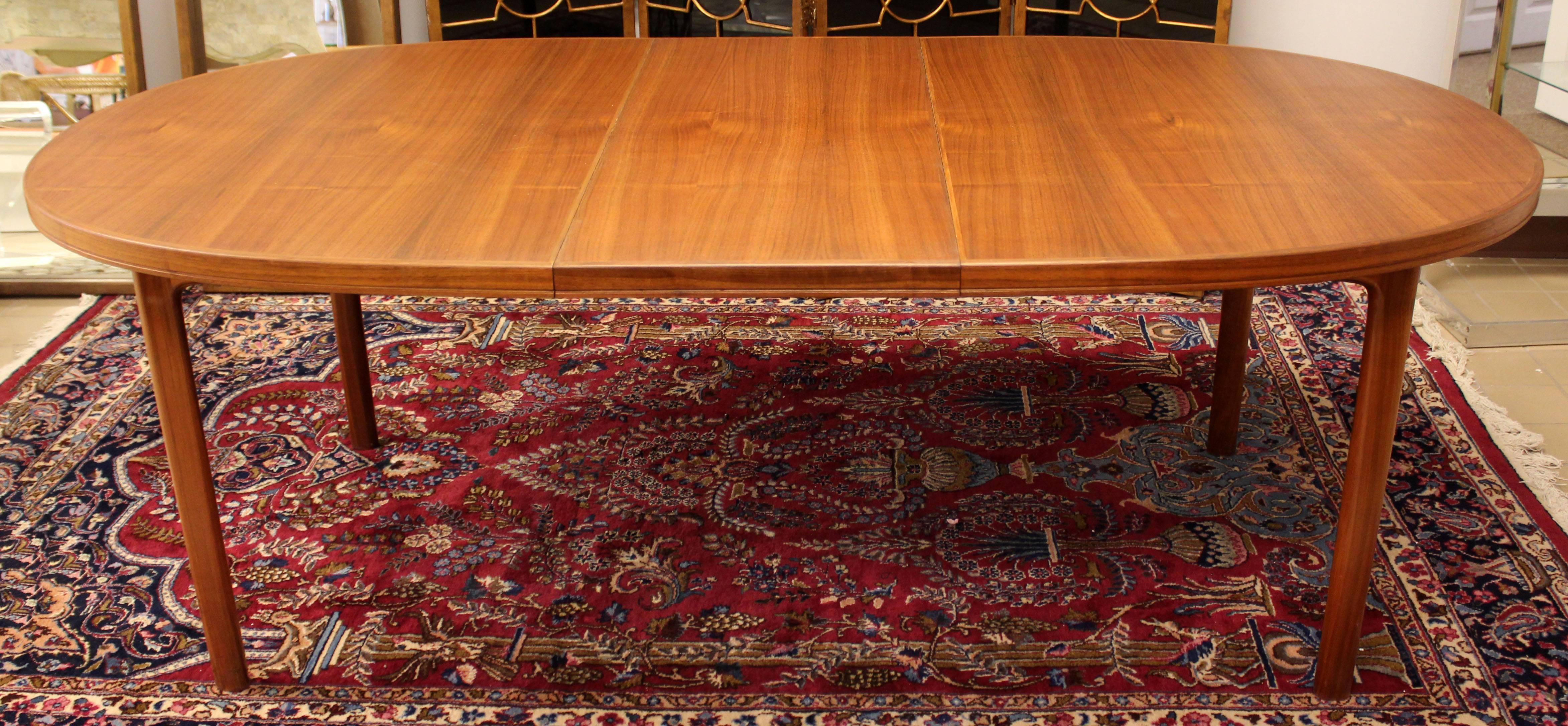 For your consideration is a marvellous, dining table, made of teak and with two leaves, by Danish company DUX, circa 1960s. In excellent condition. The dimensions are 65