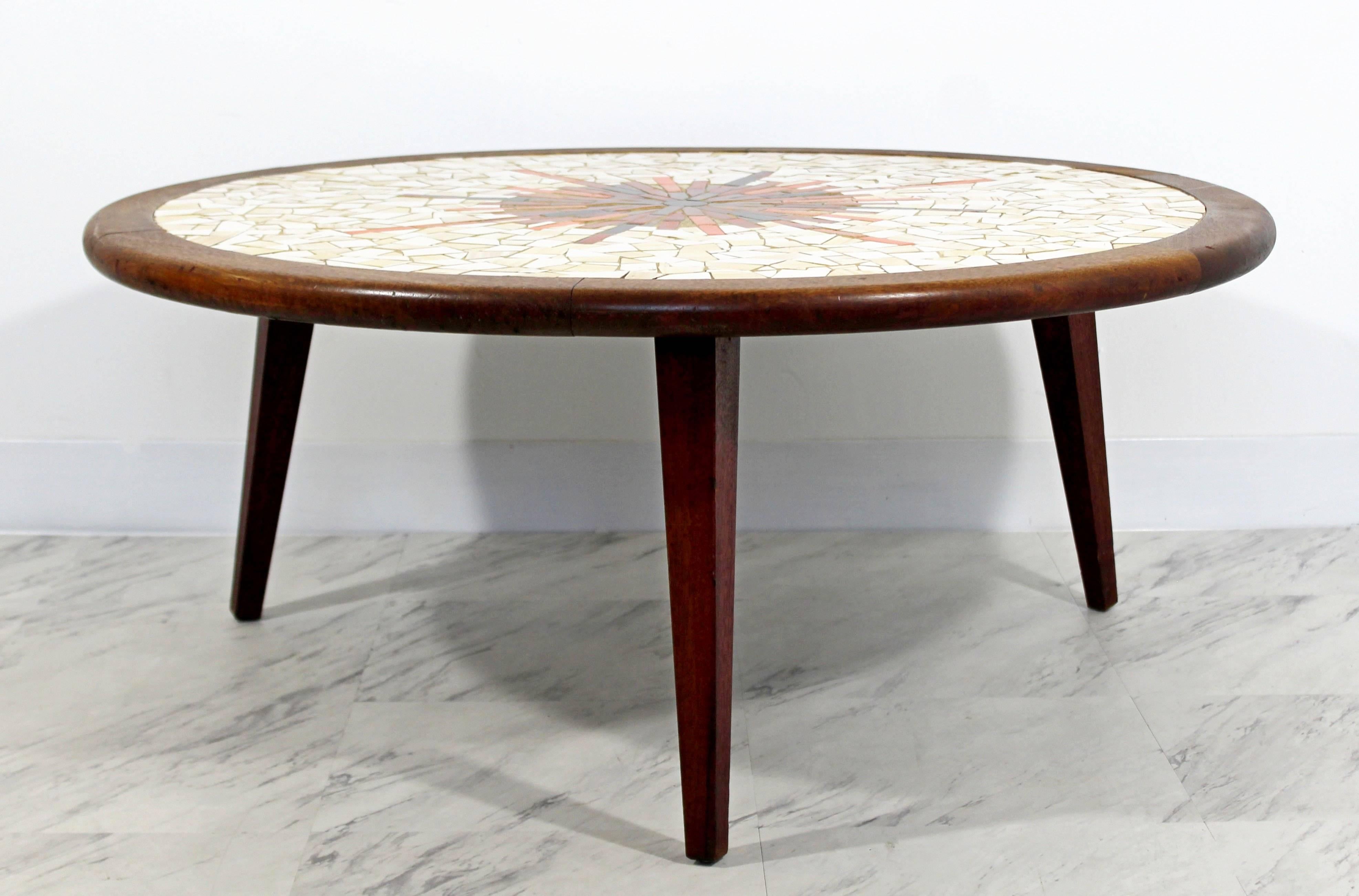 For your consideration is a sunburst or starburst, tile mosaic top, wooden coffee table, stamped Hohenberg Original on bottom. In excellent condition. The dimensions are 36