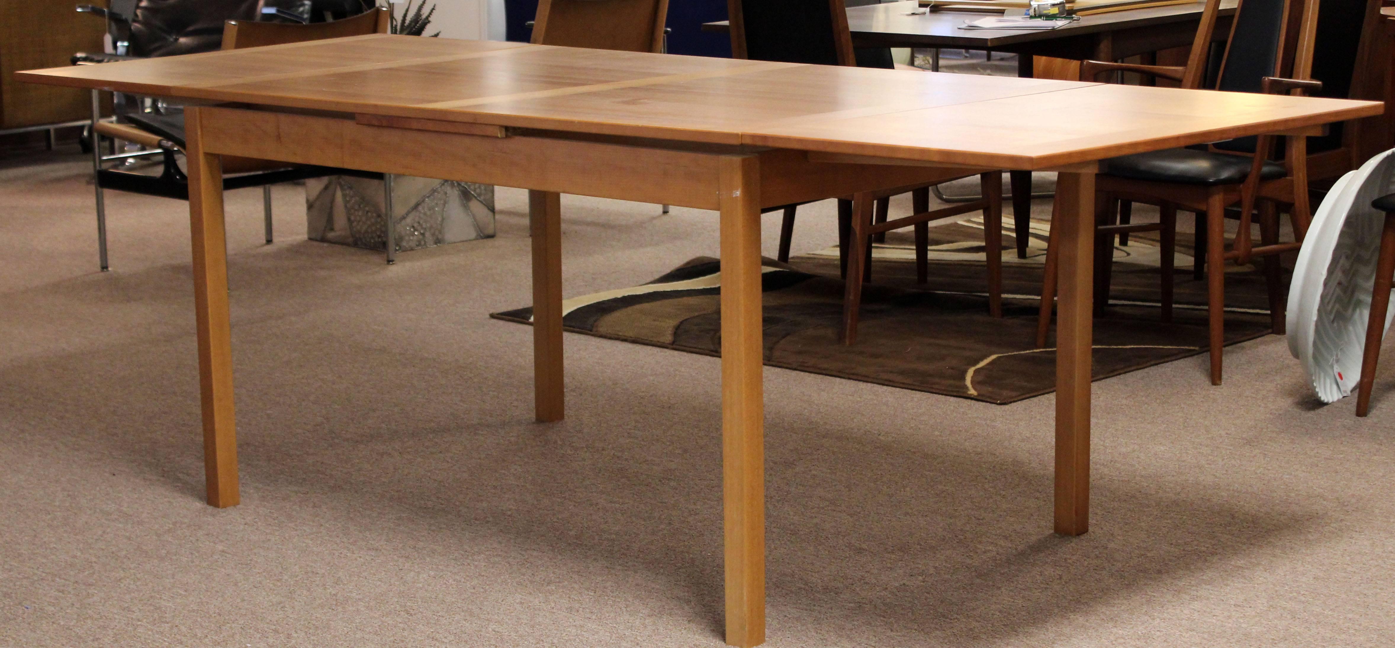For your consideration is a gorgeous, teak, dining table, with two leaves, by Ansager Mobler, made in Denmark, circa 1950s. In excellent condition. The dimensions are 53.25/92.75