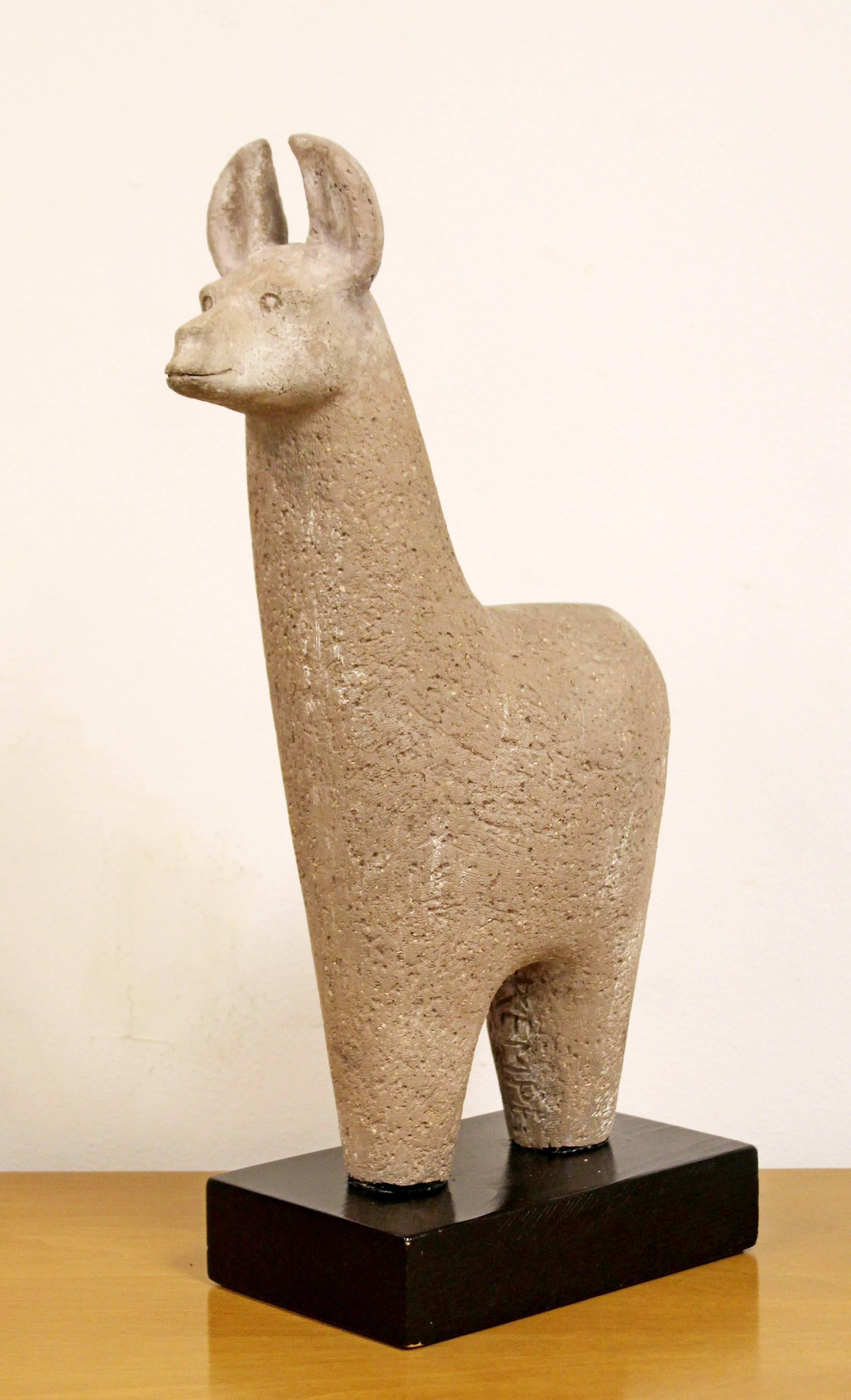 For your consideration is a gorgeous, ceramic, table sculpture of a llama, signed Kempe. In excellent condition. The dimensions are 8