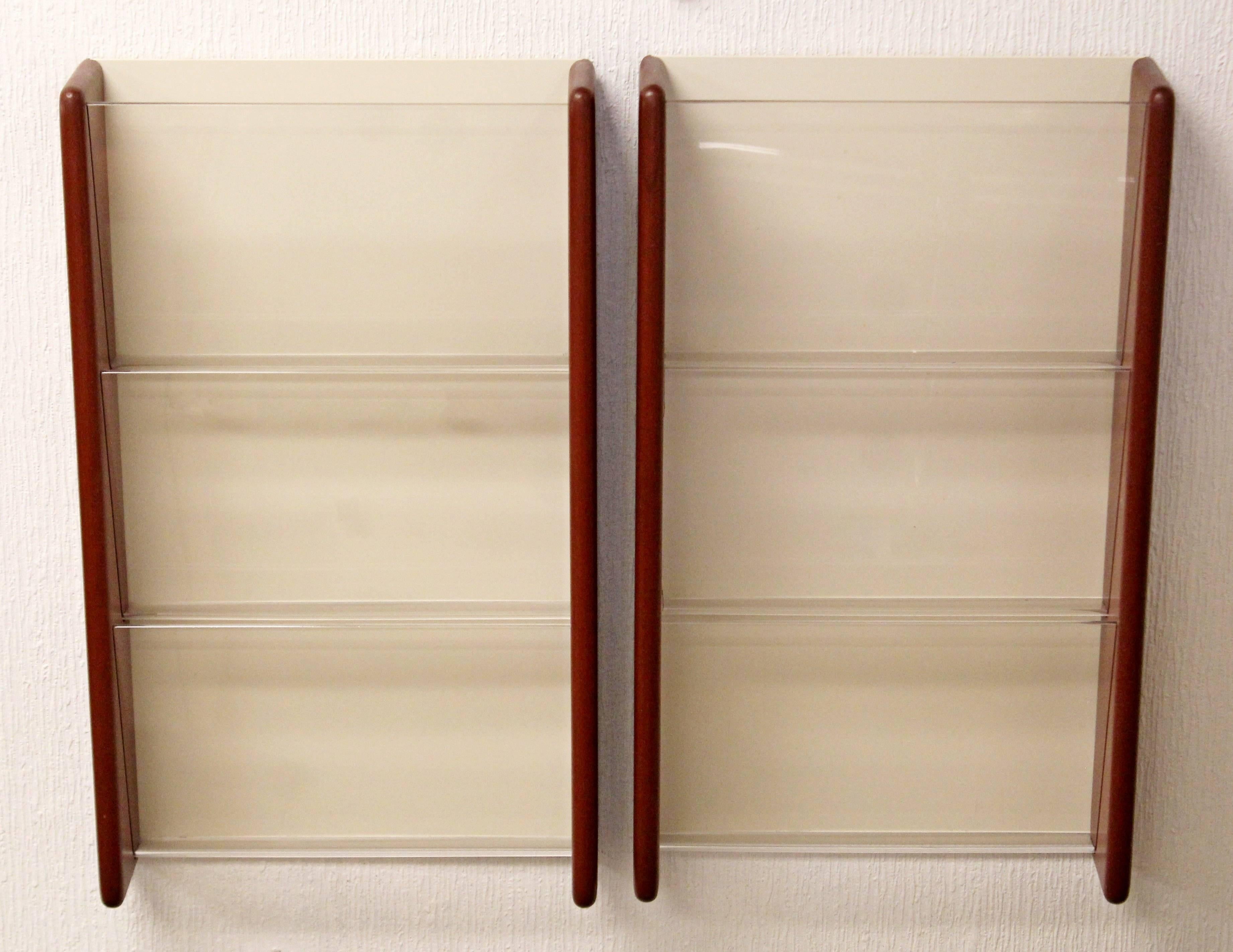 For your consideration is a pair of wall-mounted, walnut and white laminate, magazine racks by Peter Pepper, circa the 1970s. In excellent condition. The dimensions are 13.5