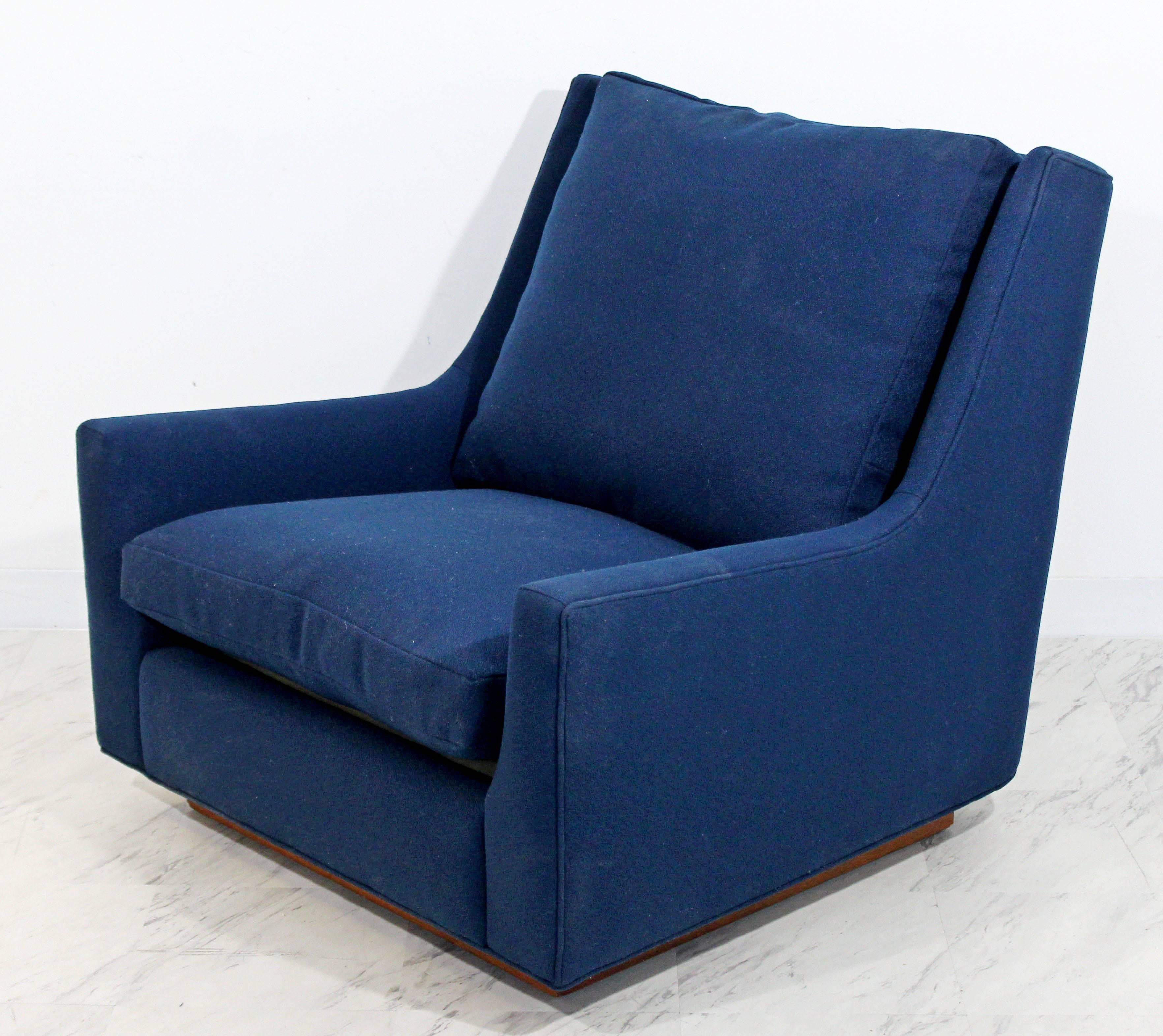 For your consideration is a rare cushy, wood plinth base, lounge chair that was designed by Milo Baughman, circa the 1970s. Just back from being professionally reupholstered in a beautiful blue boucle. Has original Thayer Coggin Milo Baughman tag.