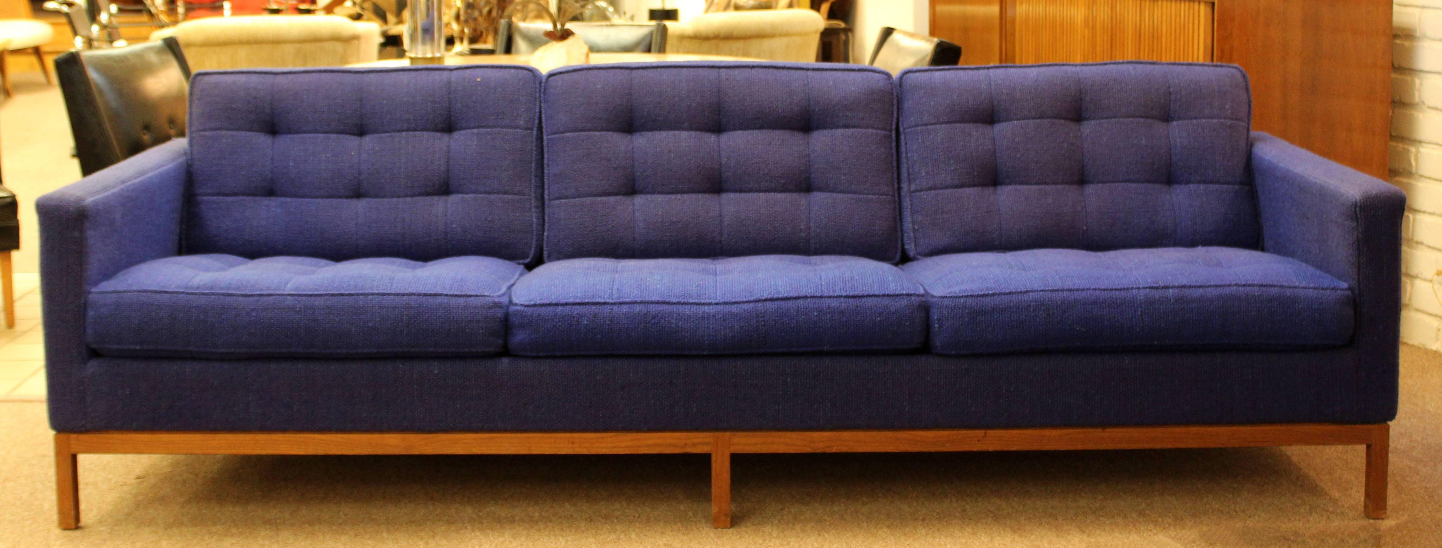 For your consideration is a fabulous and rare blue tufted, three seat sofa by Knoll, circa the 1950s. Original Knoll blue wool blend fabric. Fabric, frame and foam is in excellent condition except for outside of the arms has very slight fading. The