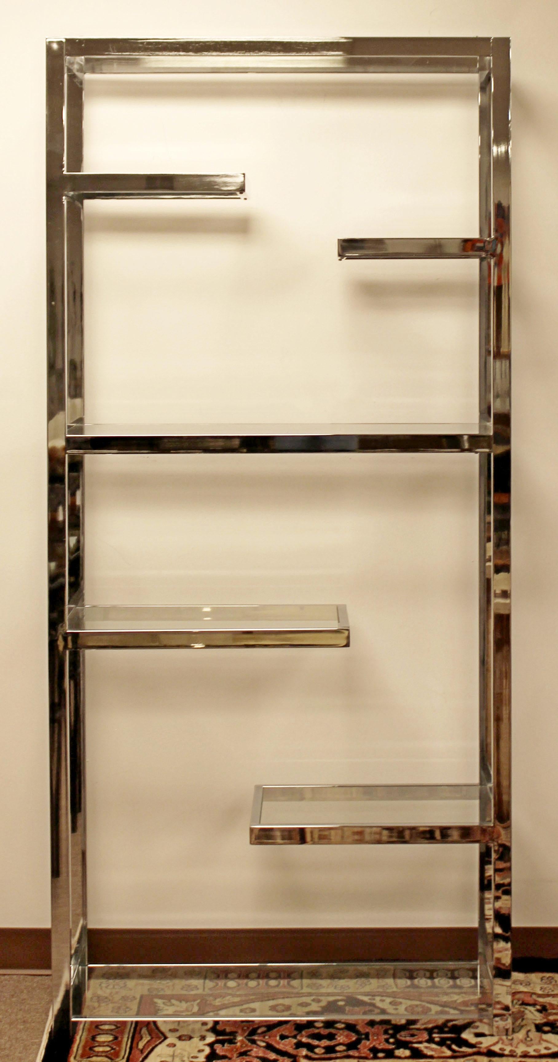 For your consideration is a magnificent, chrome étagère shelving unit, with six uneven shelves, by Milo Baughman, circa the 1970s. In excellent condition. The dimensions are 36