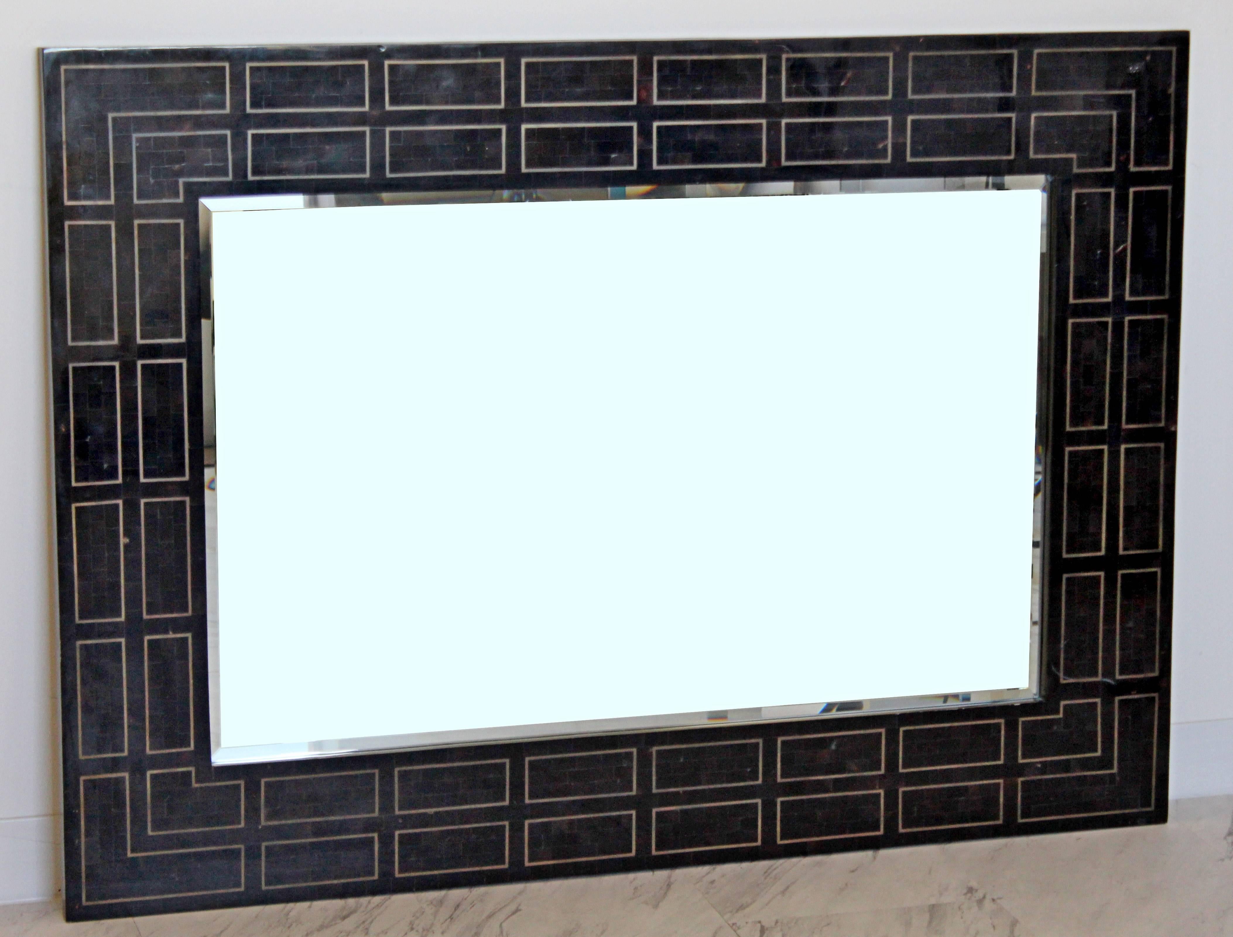 For your consideration is a phenomenal, large, rectangular, hanging wall mirror, made of tessellated stone, by Maitland Smith. In excellent condition. The dimensions are 50