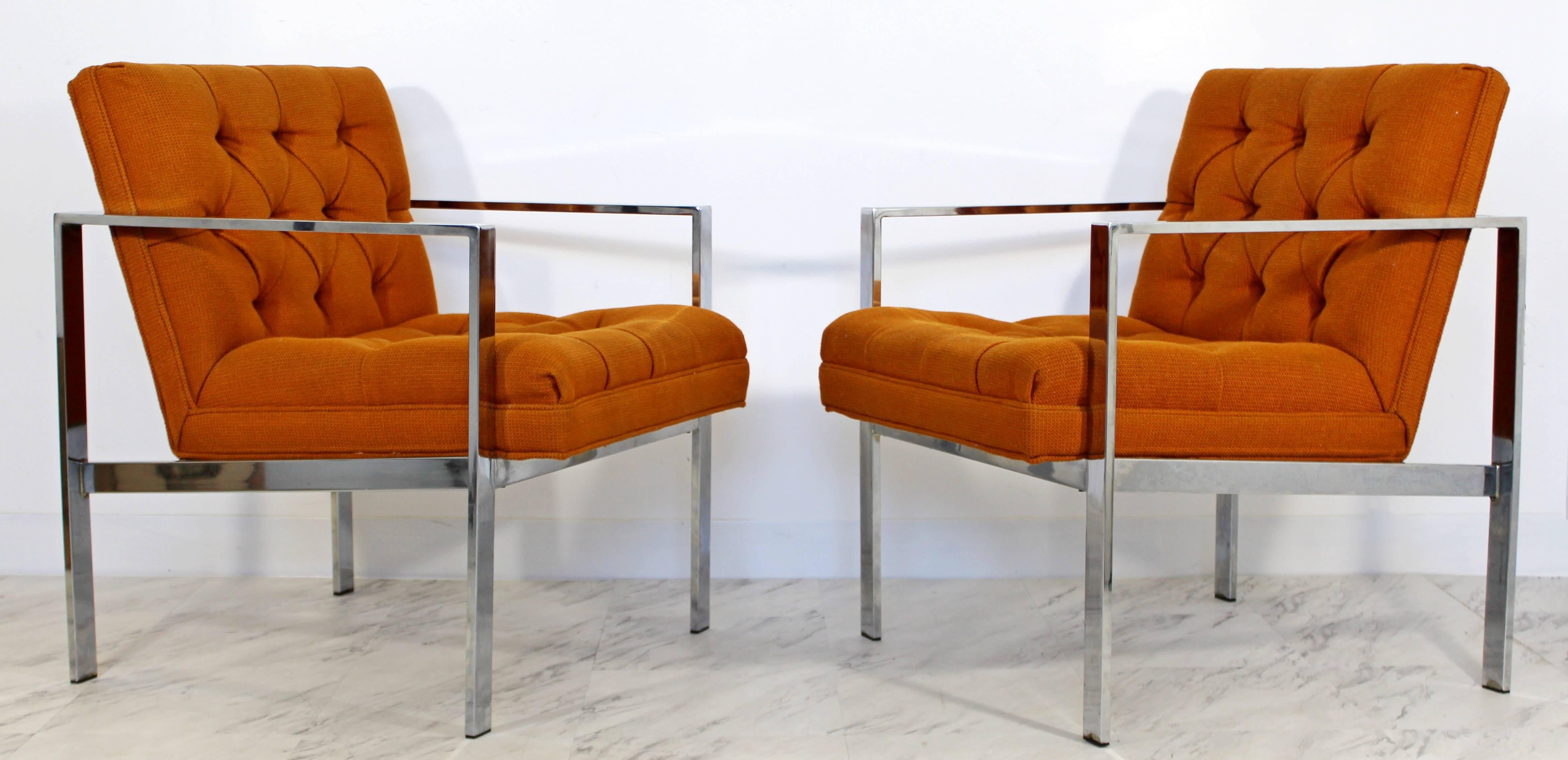 For your consideration is a gorgeous pair of flat bar chrome armchairs, with a tufted orange upholstery, by Milo Baughman, circa the 1970s. In excellent condition. The dimensions are 24