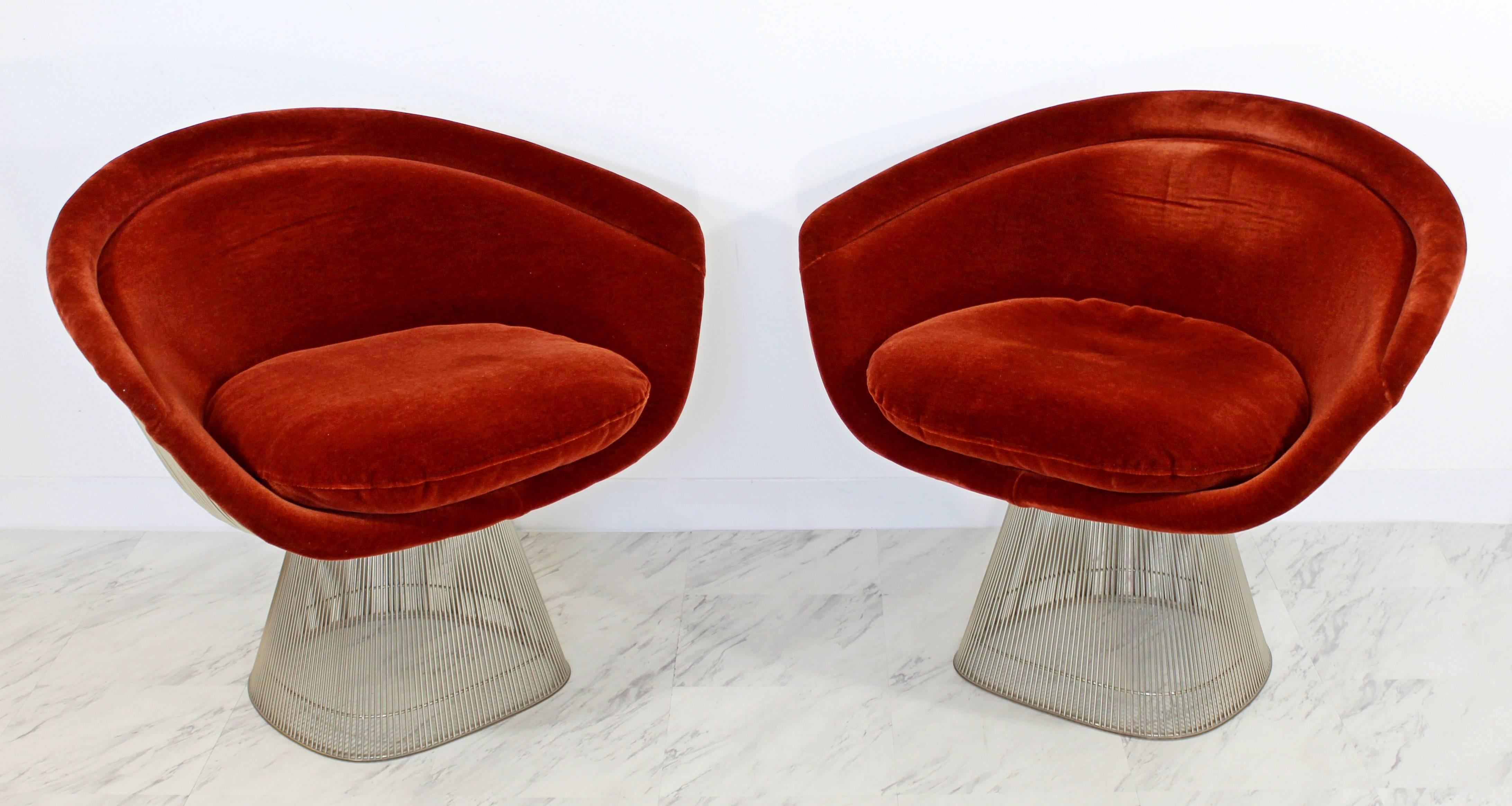 For your consideration is a luxe pair of wire framed lounge chairs, with a plush, burgundy velvet fabric, by Warren Platner for Knoll, circa 1960s. Original fabric and tags. In excellent condition. The dimensions are 36