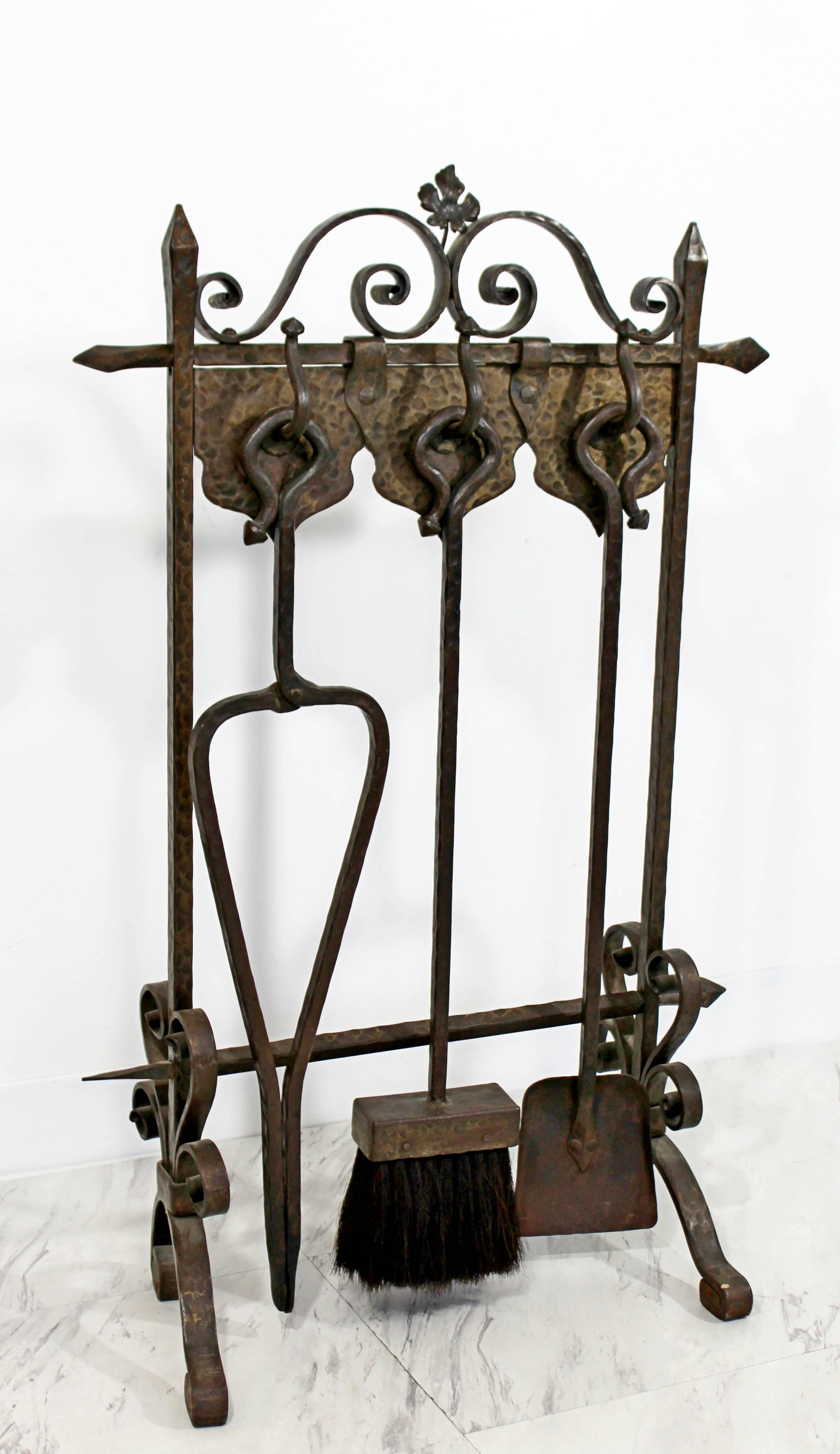 For your consideration is an incredibly rare French Art Deco hand-forged, wrought iron, fireplace set that includes a screen, tools and andirons. In excellent condition. The dimensions of the tool set is 23