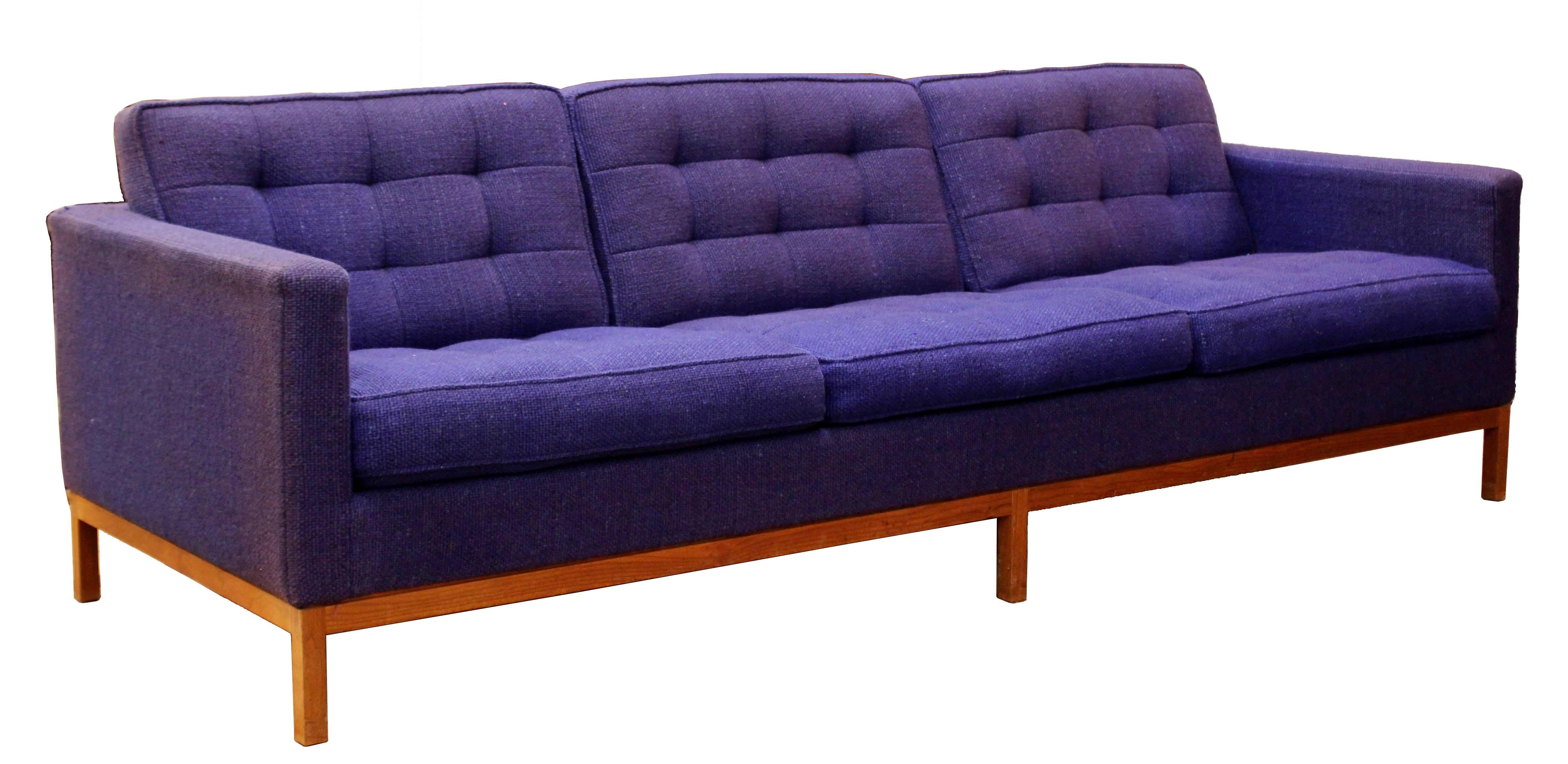 For your consideration is a magnificent and rare tufted blue upholstered sofa and loveseat set, by Florence Knoll Model #1205 S3, circa the 1950s. The fabric is original Knoll wool blend. Fabric, frame and foam are in excellent shape except for
